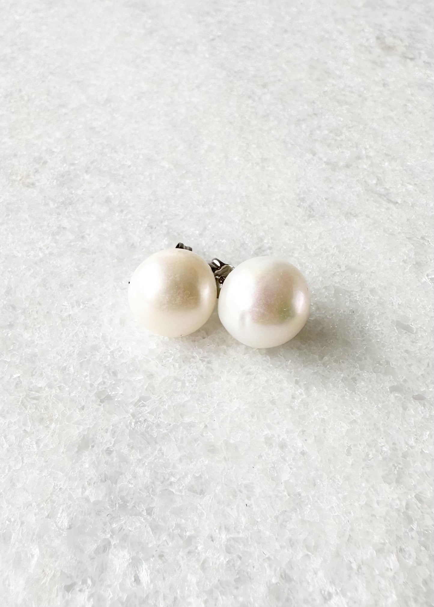 These Pretty White 10-11mm Freshwater Pearl Stud Earrings are on Sterling Silver Post and Butterfly.  A Fan Favorite!