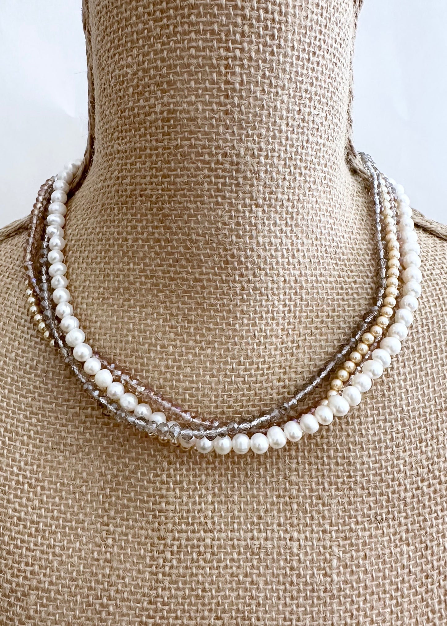 Four Strand 18” Necklace with Pearl, Shell Pearl and Two Tones of Faceted Crystal Completed with Strong secure Magnetic Clasp for Easy Wear.  Wear it Draped or Twisted for Variety. On Bust