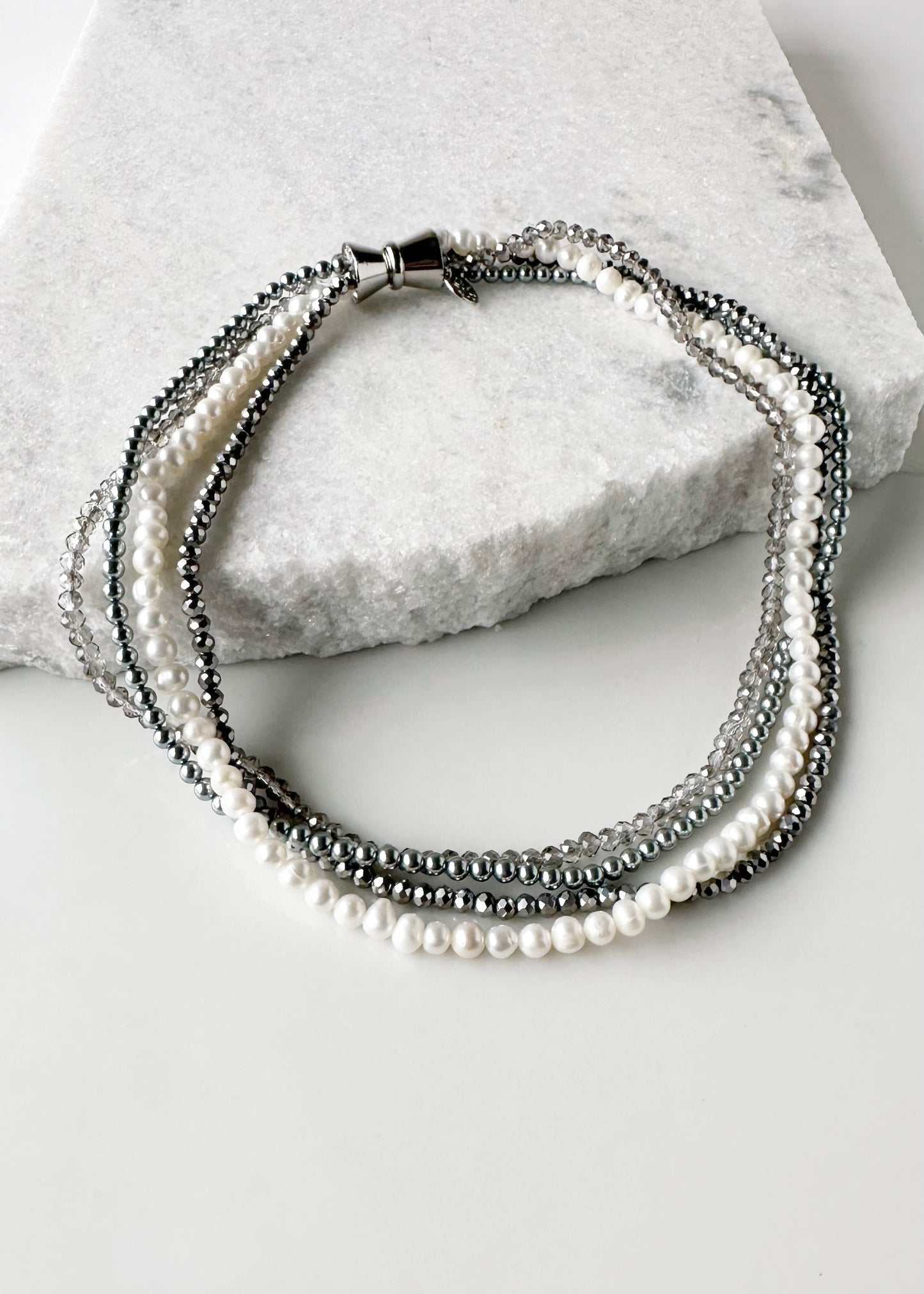 Four Strand 18” Necklace with Pearl, Shell Pearl and Two Tones of Faceted Crystal Completed with Strong secure Magnetic Clasp for Easy Wear.  Wear it Draped or Twisted for Variety.