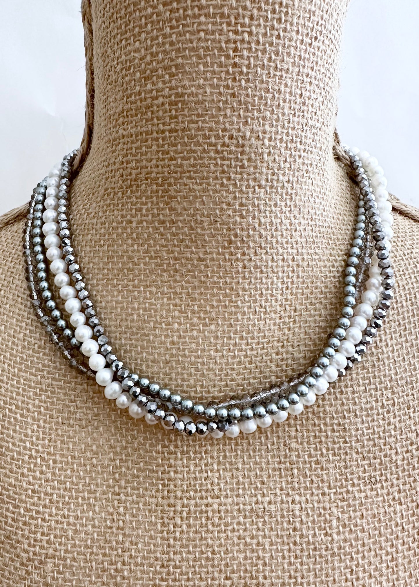 Four Strand 18” Necklace with Pearl, Shell Pearl and Two Tones of Faceted Crystal Completed with Strong secure Magnetic Clasp for Easy Wear.  Wear it Draped or Twisted for Variety. On Bust