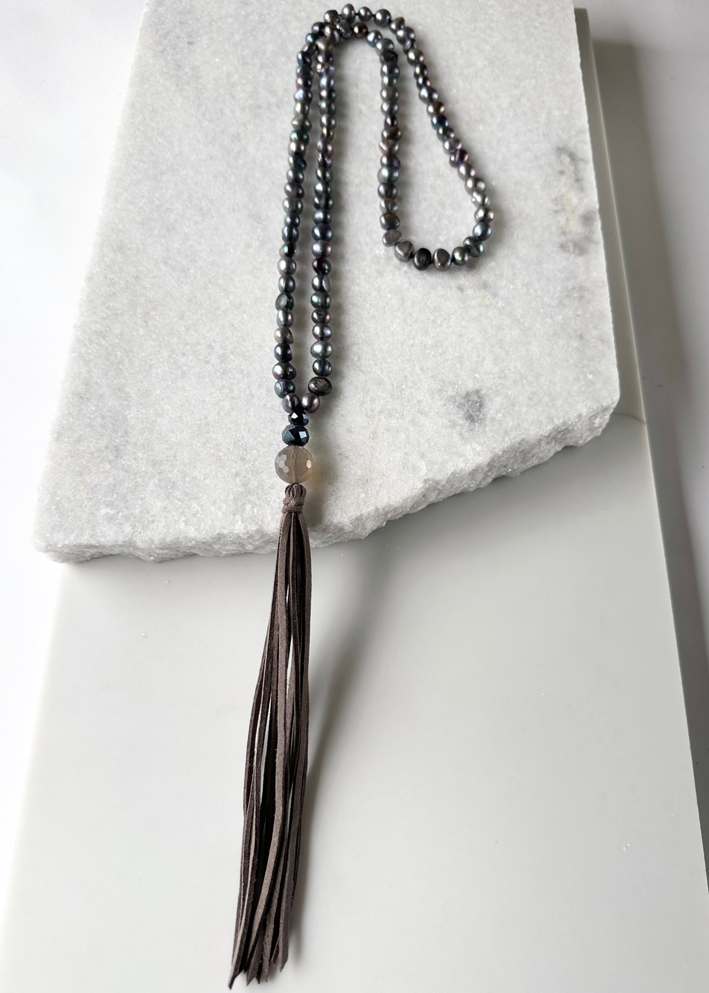 Freshwater Baroque Black 8-9mm Pearls with Agate and Crystal and a Vegan Suede Tassel in Long 23” Necklace. Great on its own or Layered.