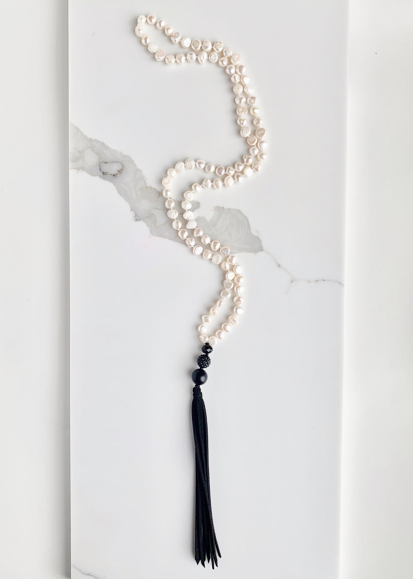 Freshwater Baroque White 8-9mm Pearls with Agate and Crystal and a Vegan Suede Tassel in Long 23” Necklace. Great on its own or Layered.