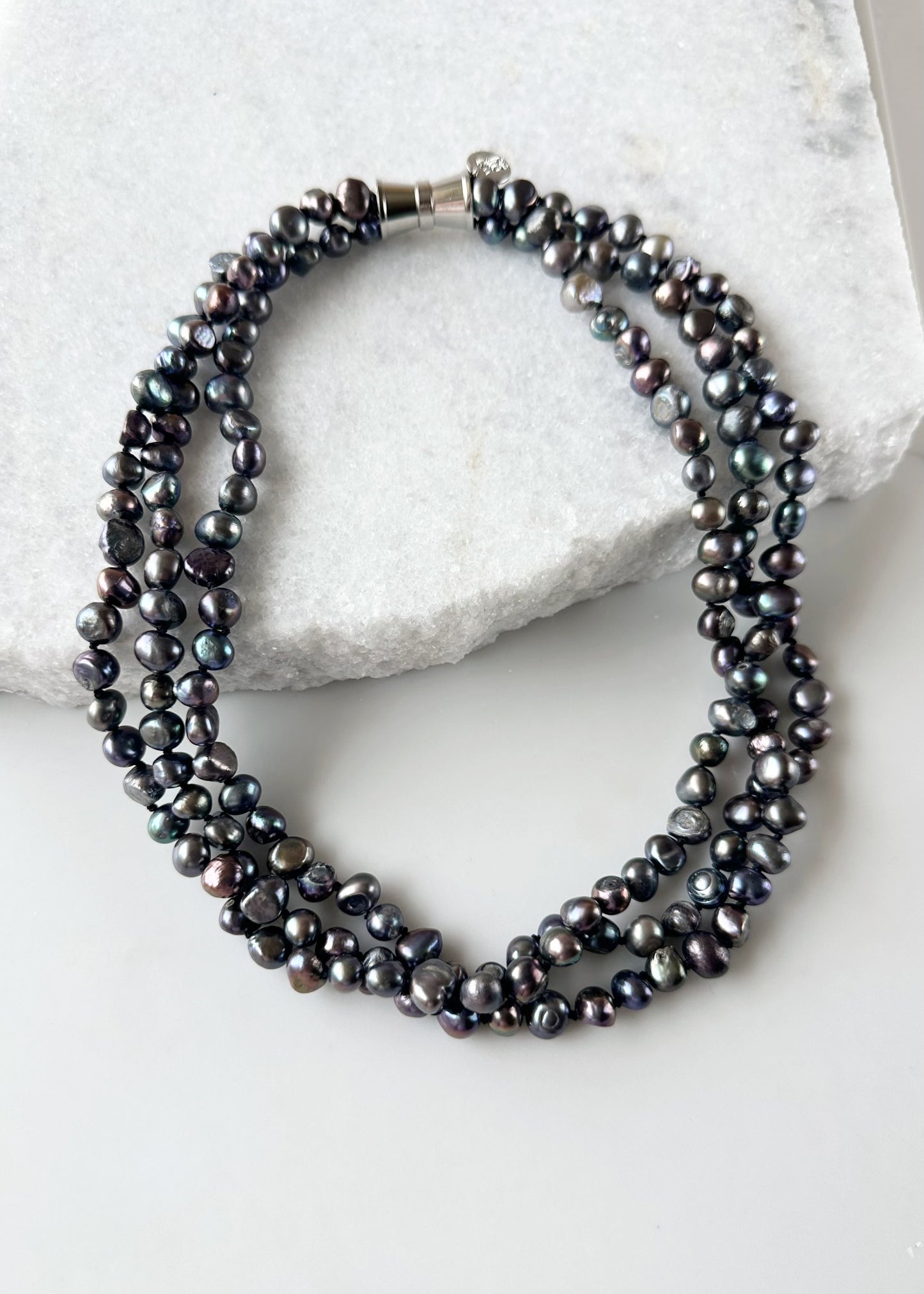 Three Strands of Knotted 8-9mm Black Freshwater Baroque Pearls with a Strong Secure Magnetic Clasp for Easy Wear.