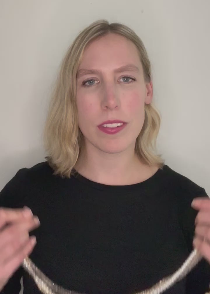 Four Strand 18” Necklace with Pearl, Shell Pearl and Two Tones of Faceted Crystal Completed with Strong secure Magnetic Clasp for Easy Wear.  Wear it Draped or Twisted for Variety. Model Trying On Piece.