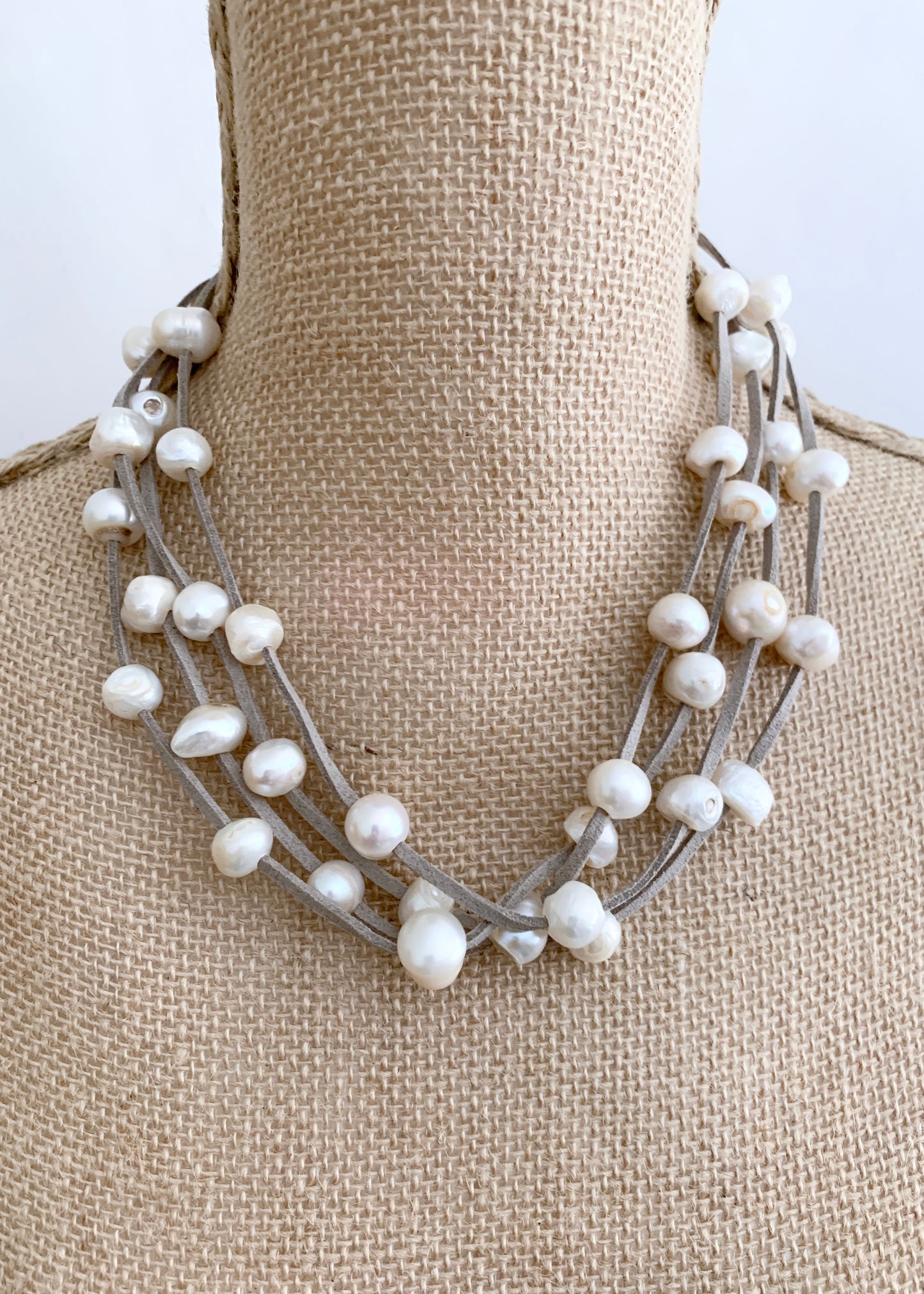 Four Strands of White Freshwater Pearls on Light Grey Vegan Suede with Secure, Strong Magnet for Easy Wear (Shown on Bust)