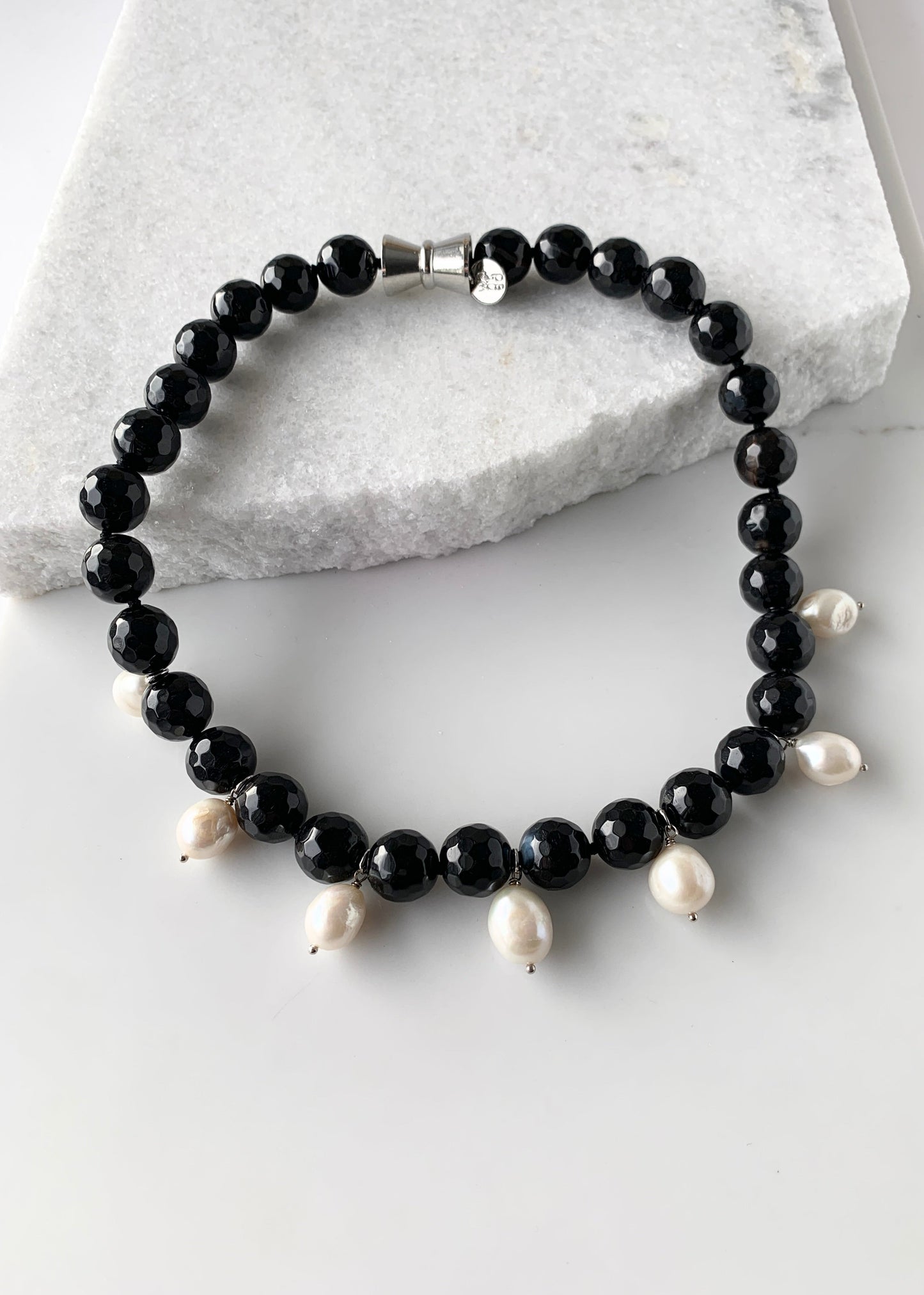 Necklace of Large Black Faceted Agate with seven White Freshwater Drop Pearls.  Strong Secure Magnetic Clasp makes for Easy Wear