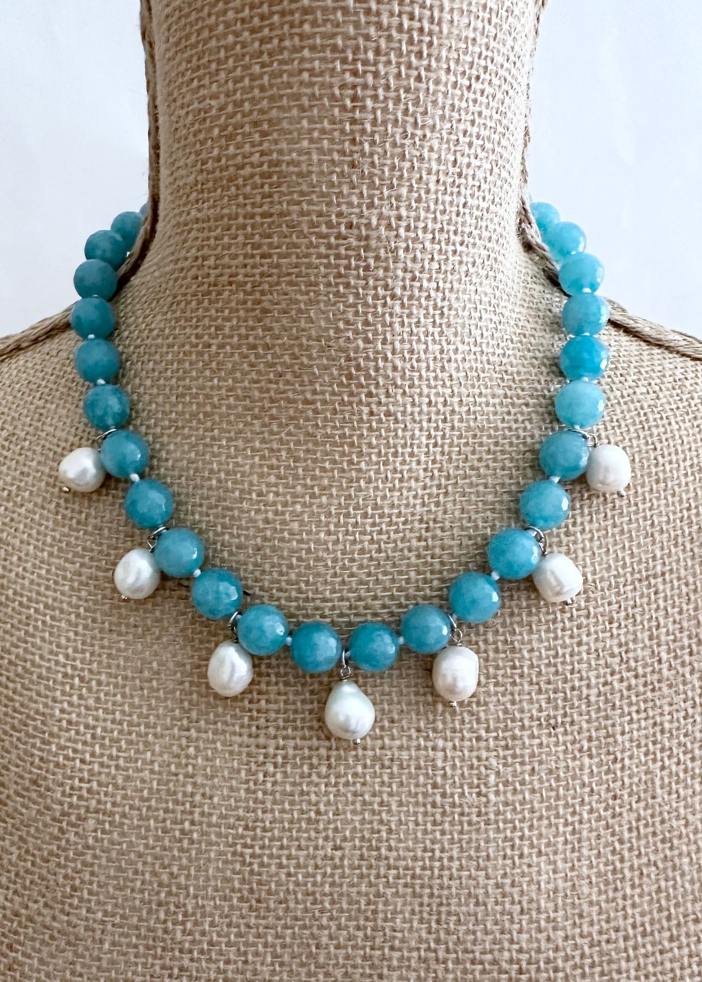 Necklace of Large Light Blue Faceted Agate with seven White Freshwater Drop Pearls.  Strong Secure Magnetic Clasp makes for Easy Wear.  Shown on Bust