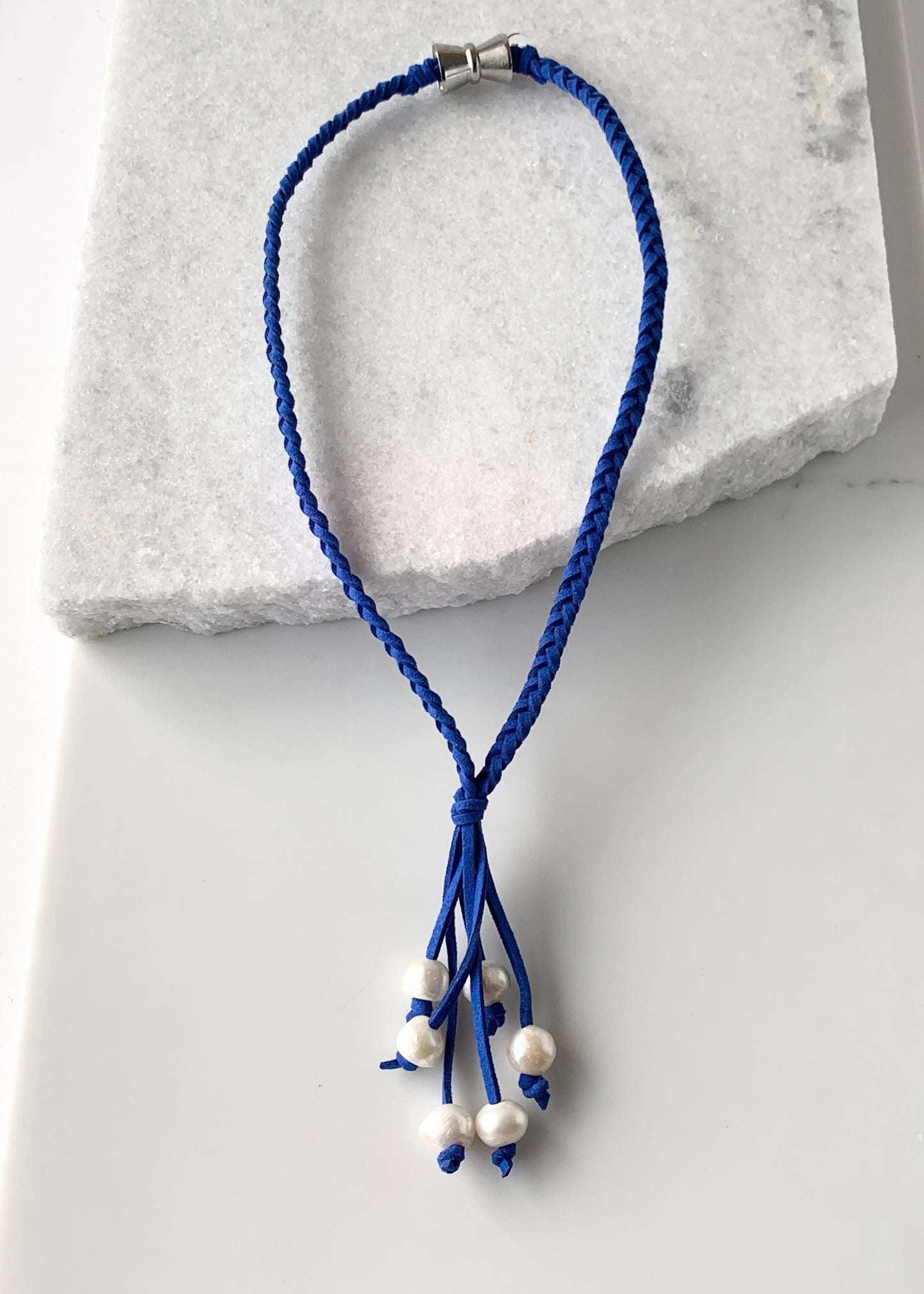 White Freshwater Pearl Necklace on Braided Royal Blue Vegan Suede.  Strong Secure Magnetic Clasp for Easy Wear.