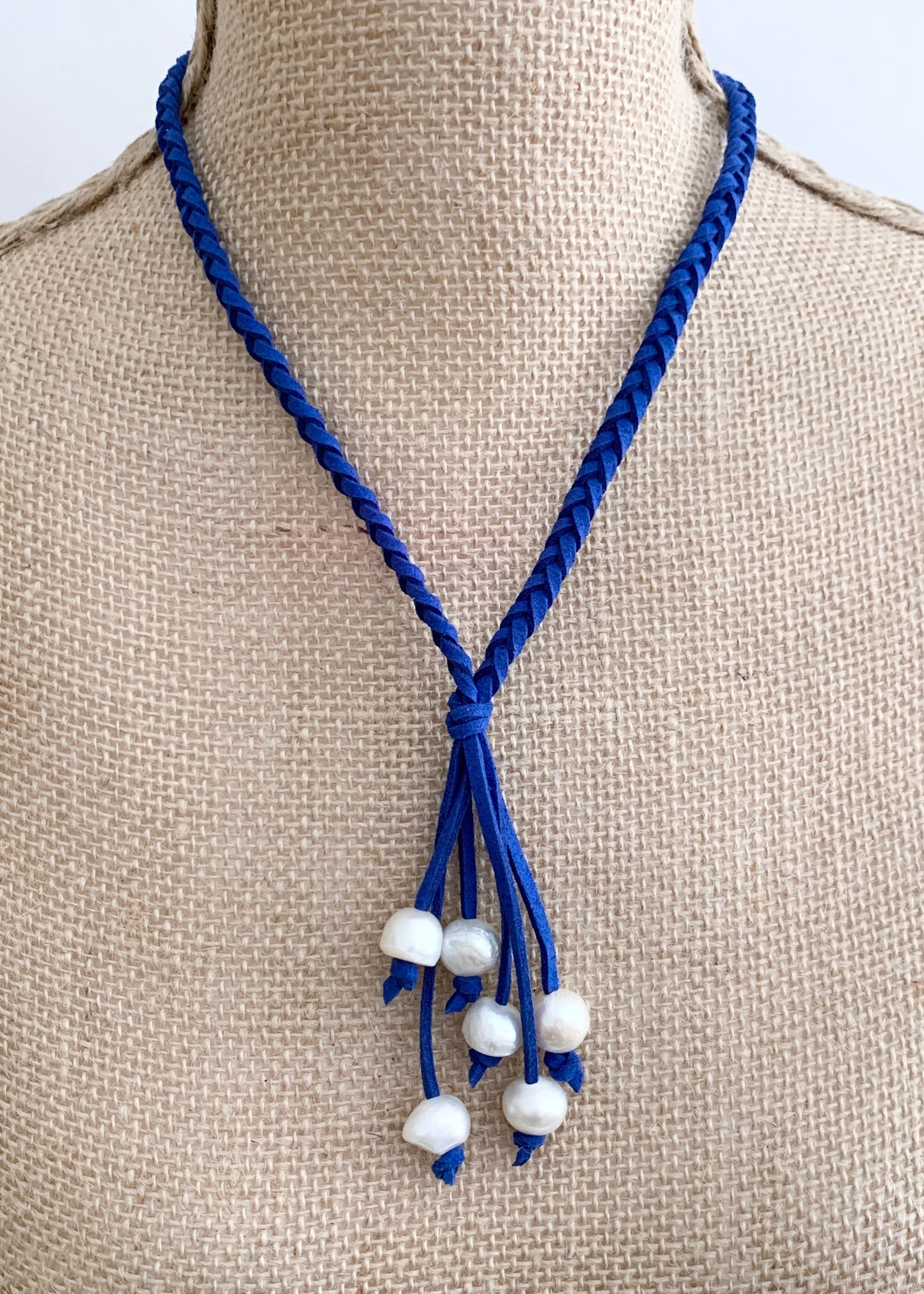 White Freshwater Pearl Necklace on Braided Royal Blue Vegan Suede.  Strong Secure Magnetic Clasp for Easy Wear. Shown on Bust