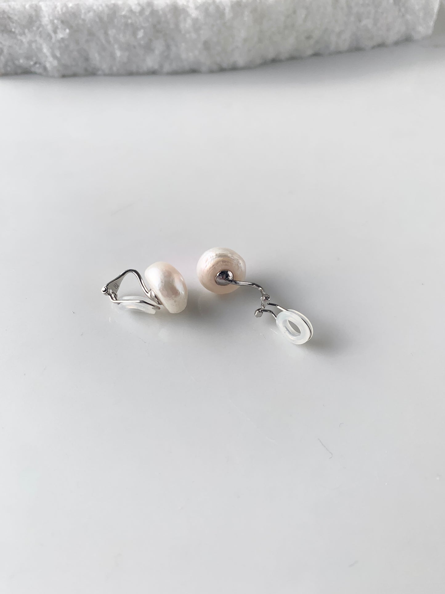 Large White Baroque Freshwater Pearl Earrings using Sterling Silver Clip-ons with Comfortable Silicone Back. One Clip-on open showing Silicone Back