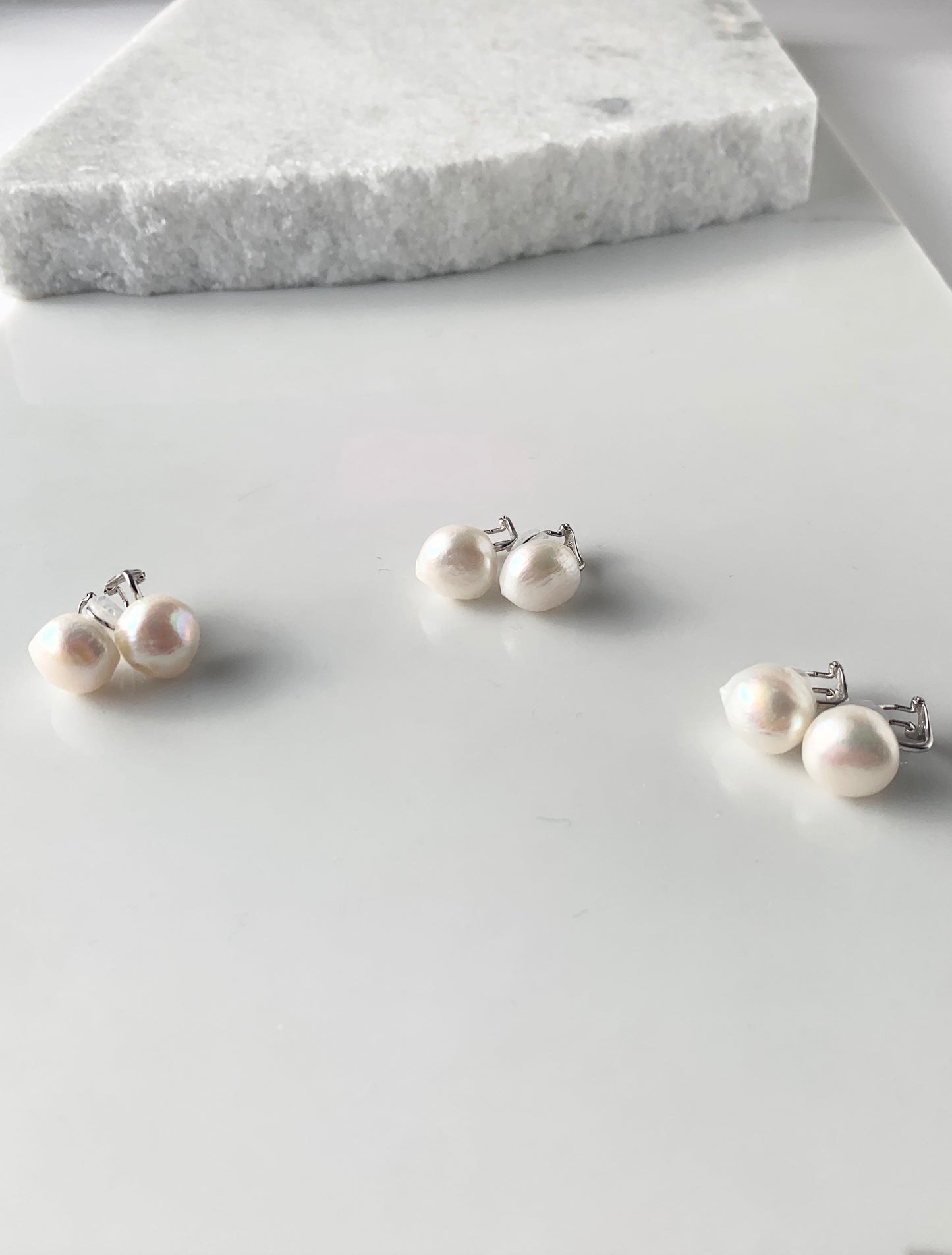Large White Baroque Freshwater Pearl Earrings using Sterling Silver Clip-ons with Comfortable Silicone Back. Three Pairs Showing