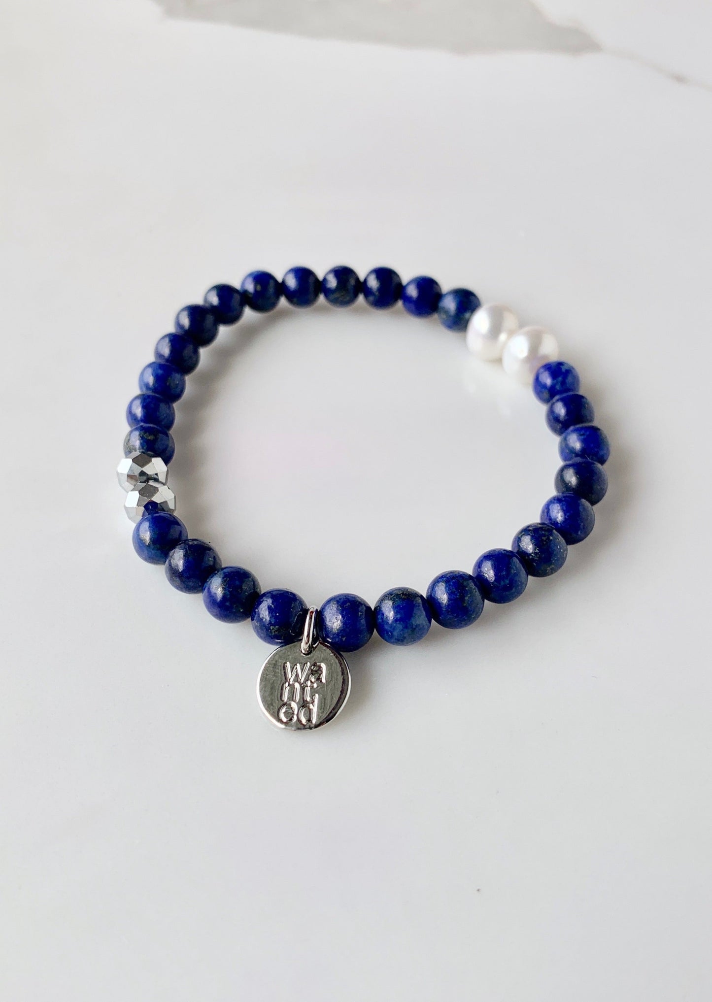 This Stackable Stretch Bracelet is designed with two pearls, two crystals and Blue Agate Semi-Precious Stones.  This can be worn by itself or with Gail and Ava Bracelets.