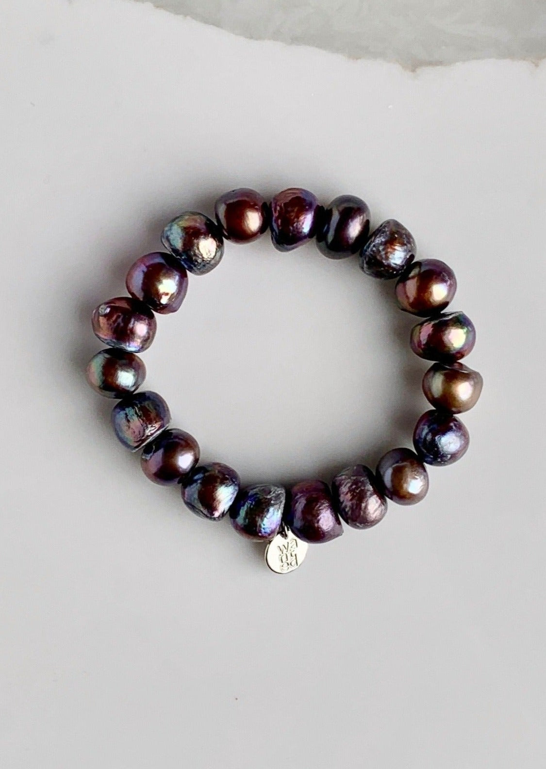 Large Baroque Black Freshwater Pearls are designed in this Stretch Bracelet. This can be worn by itself or Stacked with others.
