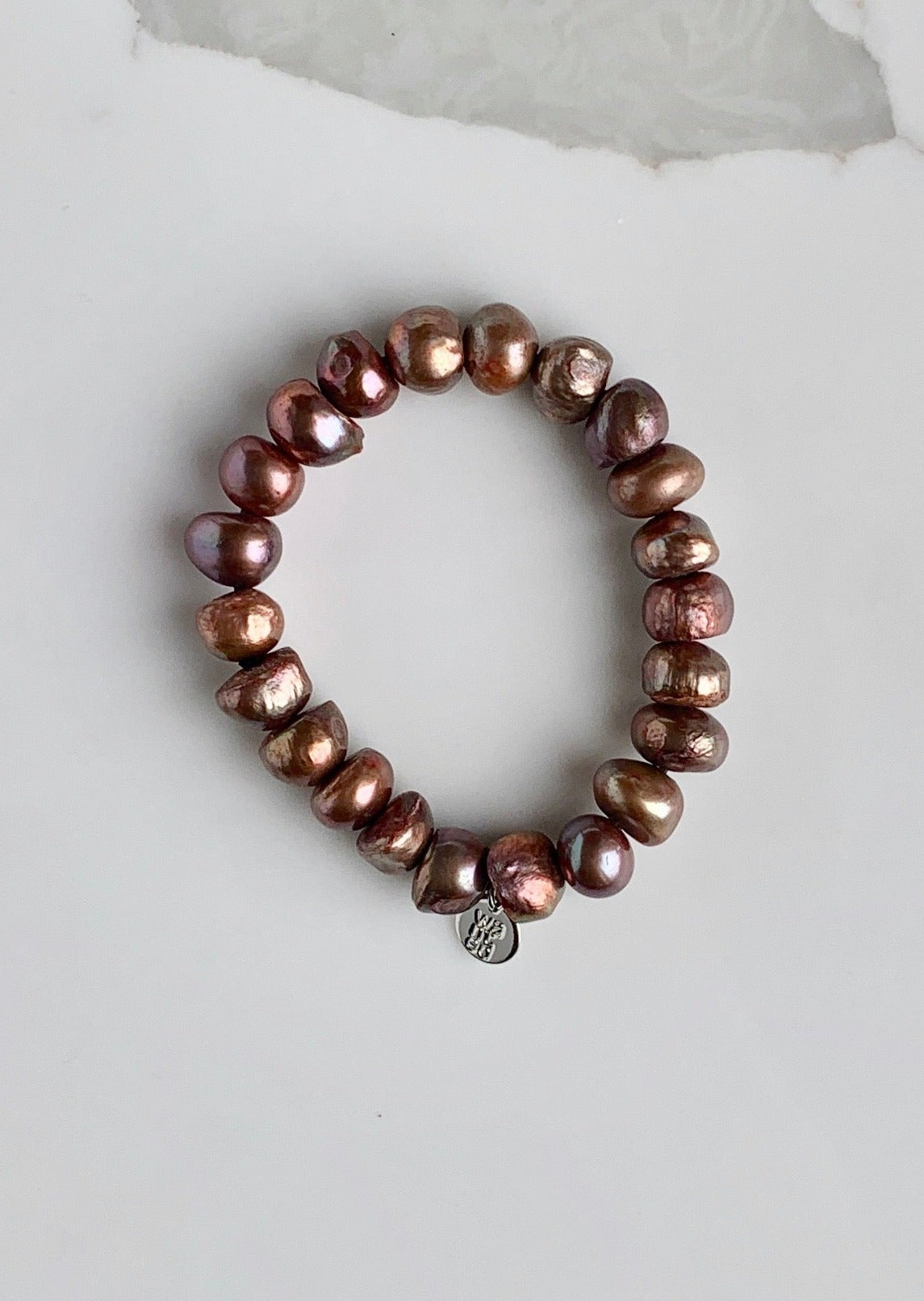 Large Baroque Brown Freshwater Pearls are designed in this Stretch Bracelet. This can be worn by itself or Stacked with others.