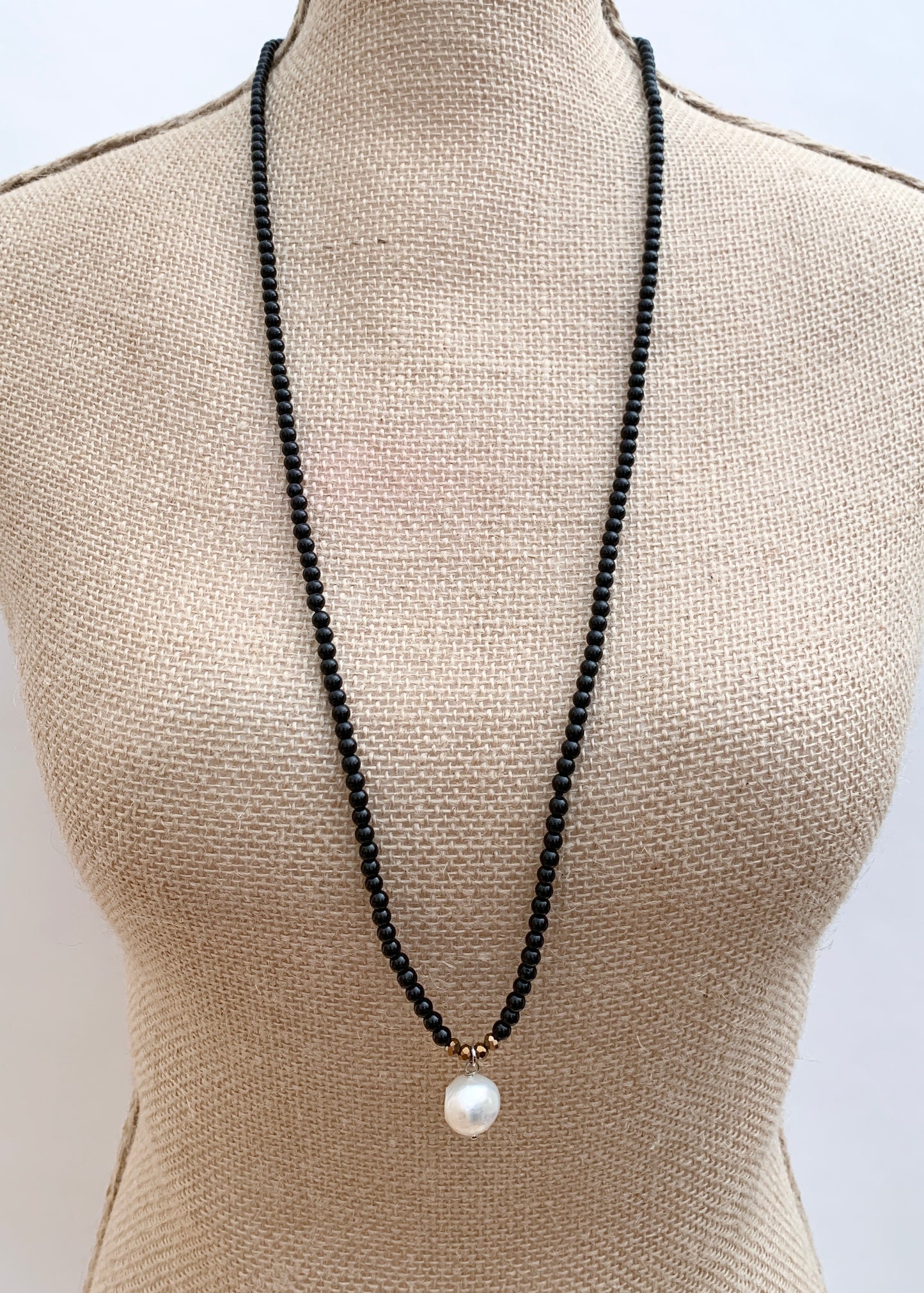 Simple and Elegant, a Large Freshwater Pearl Drop on this Black Agate Necklace with Gold Accents. Can be worn on its own or Stacked with other Necklaces. On Bust