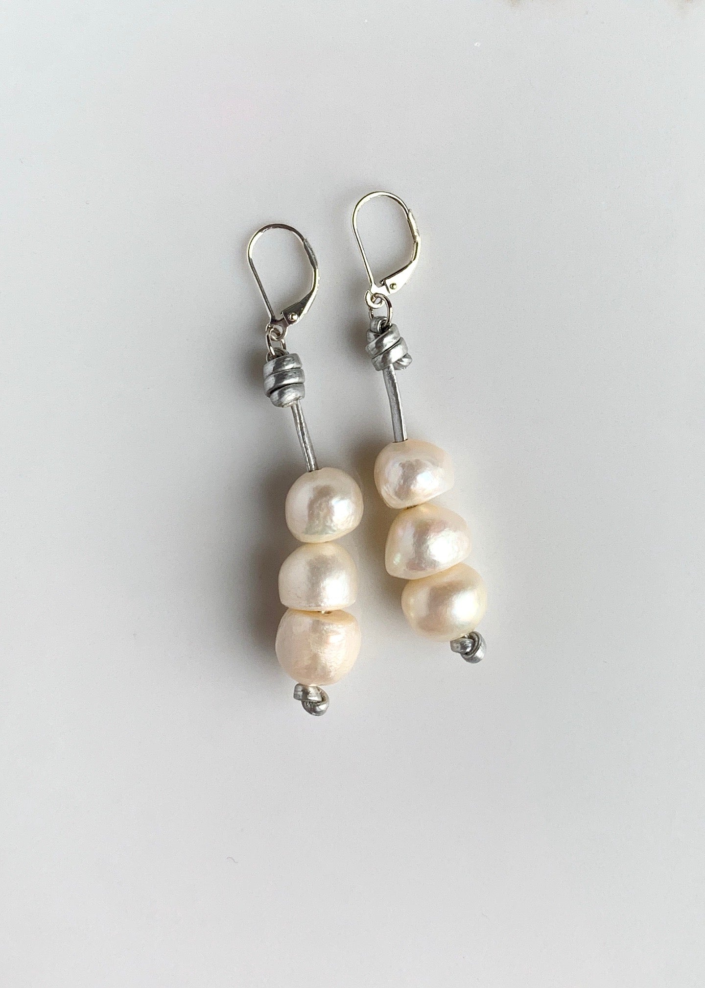 Three Stacked White Freshwater Pearls on Silver Thread with Sterling Silver Leverbacks.