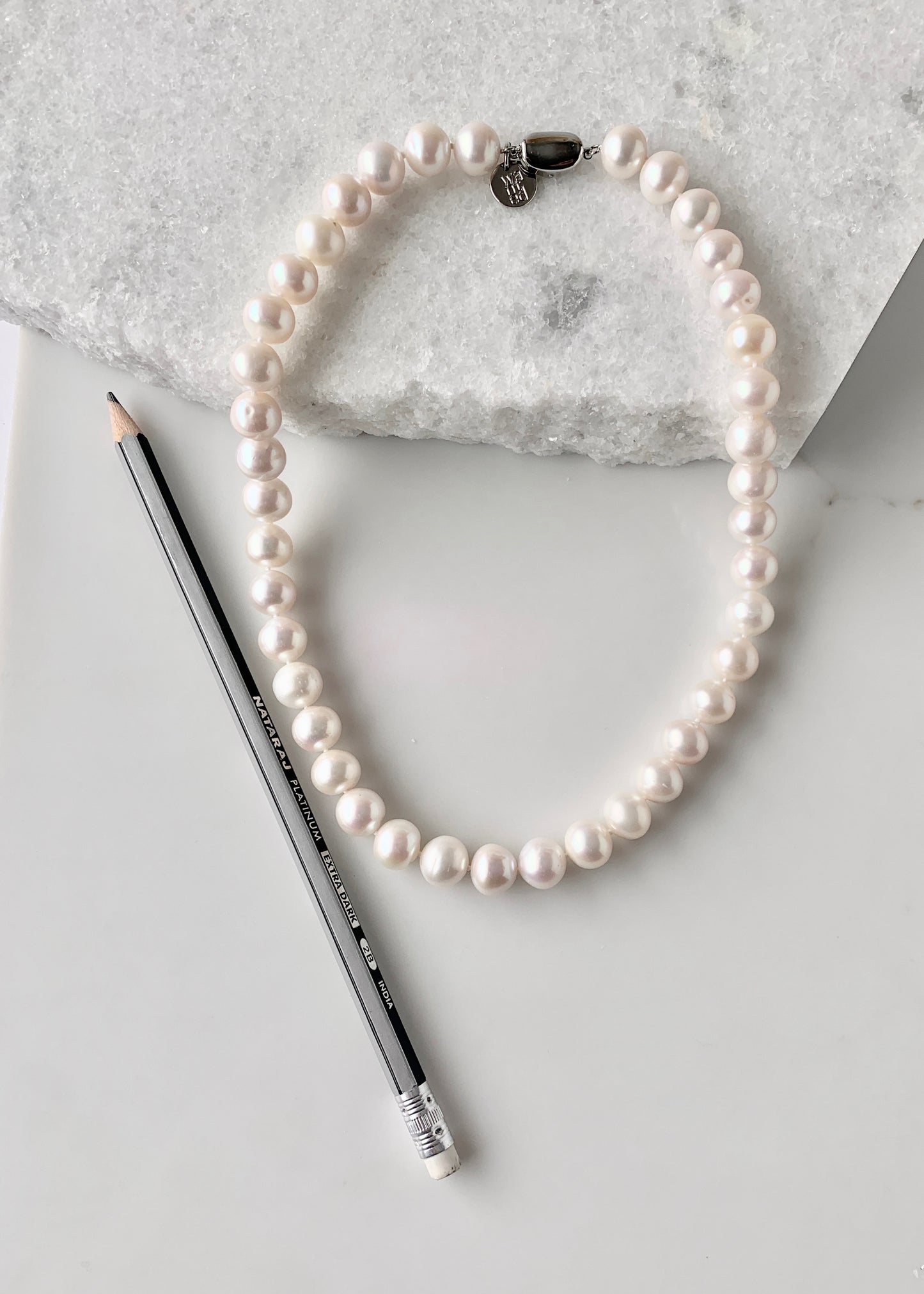 Large (11-12mm) Lustrous White Freshwater Pearl Necklace with Bean Clasp for Easy Wear. Alongside Pencil for Scale.