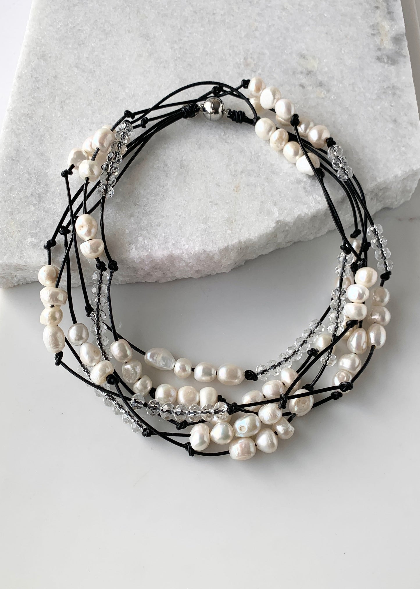 White Baroques Freshwater Pearls and White Faceted Crystals on Black Knotted Leather For a Long  39” Necklace with Strong Secure Magnetic Clasp for Easy Wear. Shown Doubed