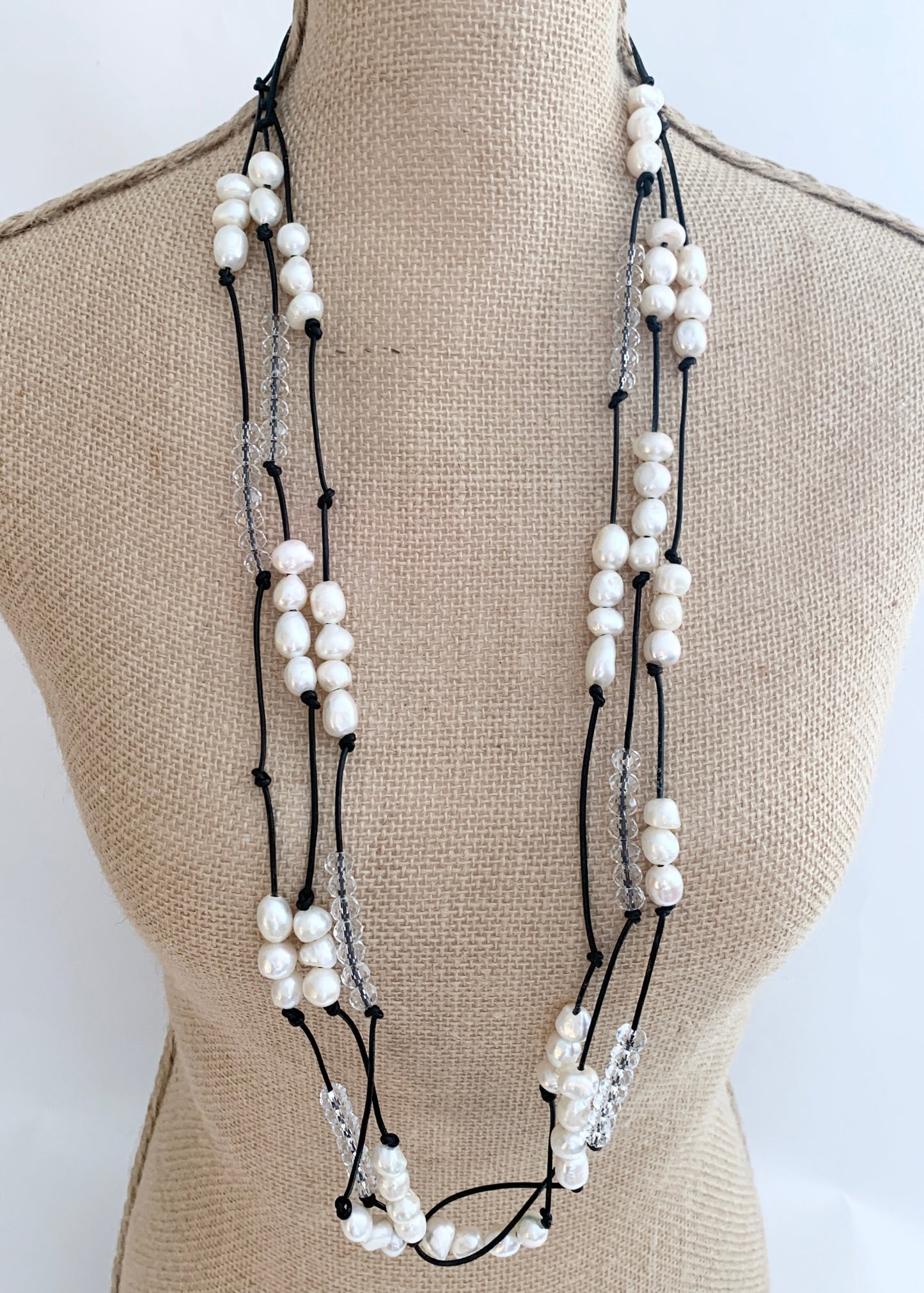 White Baroques Freshwater Pearls and White Faceted Crystals on Black Knotted Leather For a Long  39” Necklace with Strong Secure Magnetic Clasp for Easy Wear. On Bust