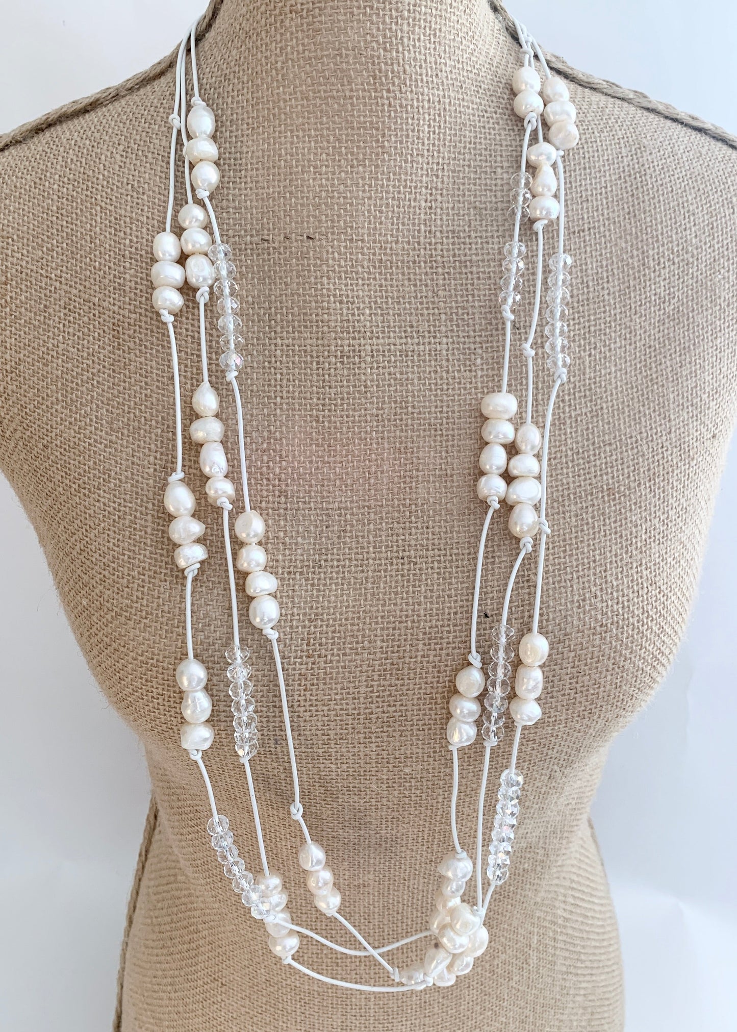 White Baroques Freshwater Pearls and White Faceted Crystals on White Knotted Leather For a Long  39” Necklace with Strong Secure Magnetic Clasp for Easy Wear. On Bust
