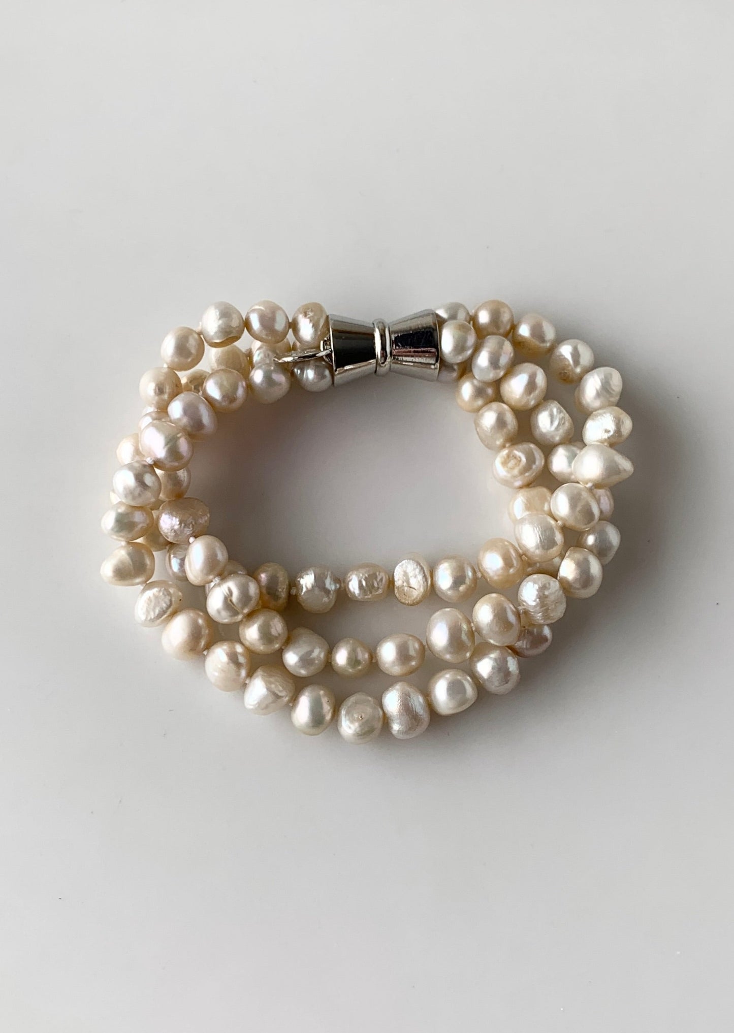 Champagne Baroque 8-9mm Freshwater Knotted Pearls on 8” Long 3-Strand Bracelet with Magnetic Clasp for Easy Wear.