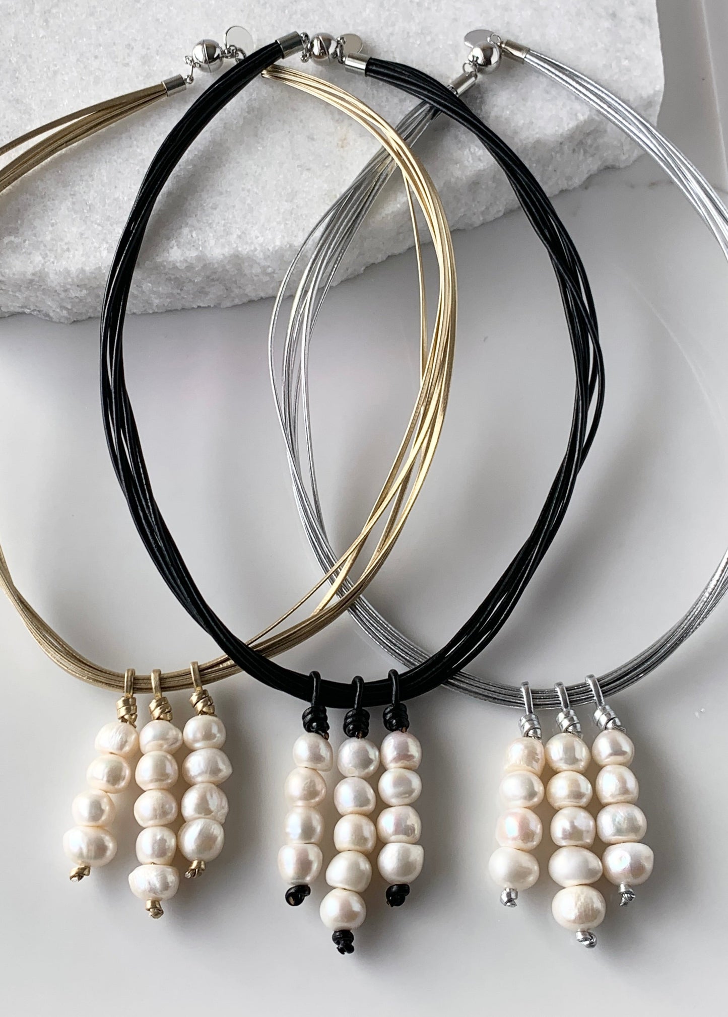 Three Stacks of White Baroque Freshwater Pearls on Metal or Leather Cord Make Up this Necklace with a Strong Secure Magnetic Clasp for Easy Wear. All Three Versions shown.