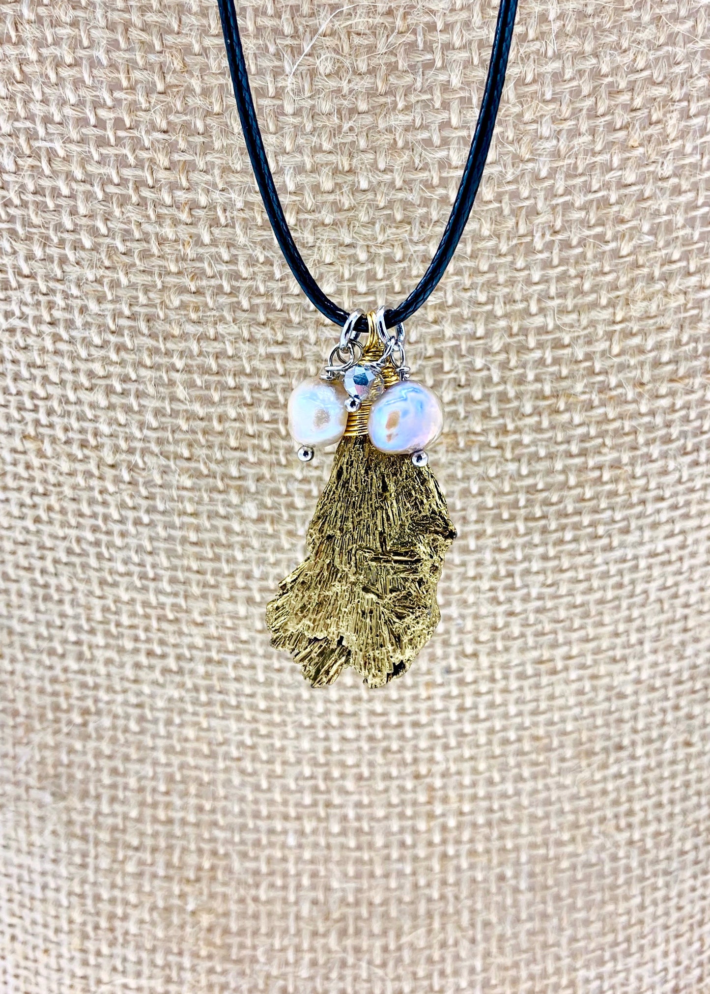 Champagne Baroque Freshwater Pearls and Faceted Crystals Dangling on Black Cotton Cord For a  Necklace with Plated Tourmaline Pendant giving a 23.6” Drop. Focus on Pendant