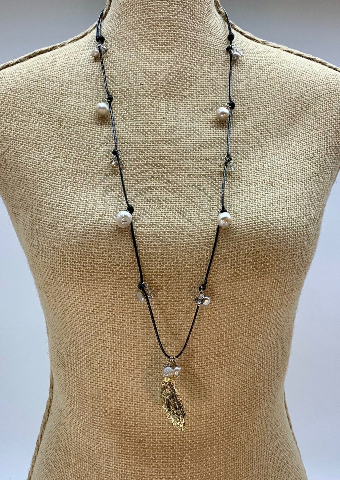 Champagne Baroque Freshwater Pearls and Faceted Crystals Dangling on Black Cotton Cord For a  Necklace with Plated Tourmaline Pendant giving a 23.6” Drop. On Bust