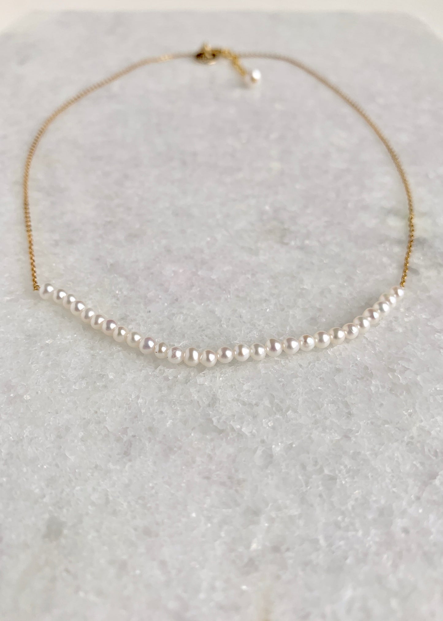 3mm Freshwater White Pearls on Yellow Gold 18” Chain with 1.25” Extender for this Delicate and Classic Necklace which can also be Worn Layered with other Favorites.  Focus on Lustrous Pearls