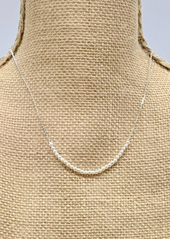 3mm Freshwater White Pearls on White Gold 18” Chain with 1.25” Extender for this Delicate and Classic Necklace which can also be Worn Layered with other Favorites.  On Bust