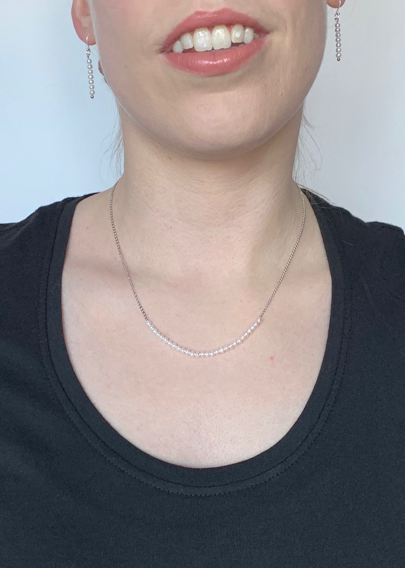 3mm Freshwater White Pearls on White Gold 18” Chain with 1.25” Extender for this Delicate and Classic Necklace which can also be Worn Layered with other Favorites.  On Model