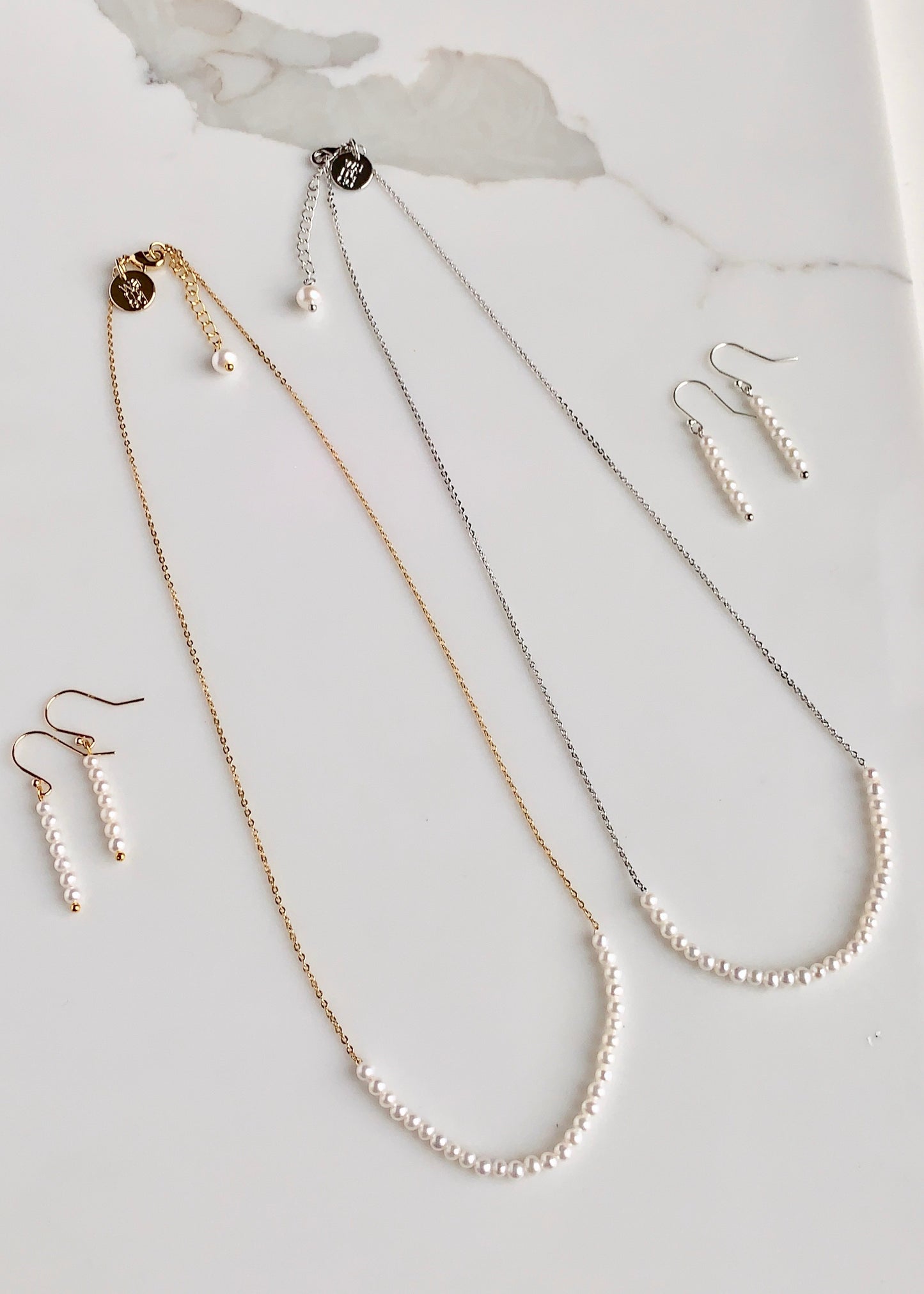 3mm Freshwater White Pearls on Yellow or White Gold 18” Chain with 1.25” Extender for this Delicate and Classic Necklace which can also be Worn Layered with other Favorites.  Both Colors shown with Matching Earrings.