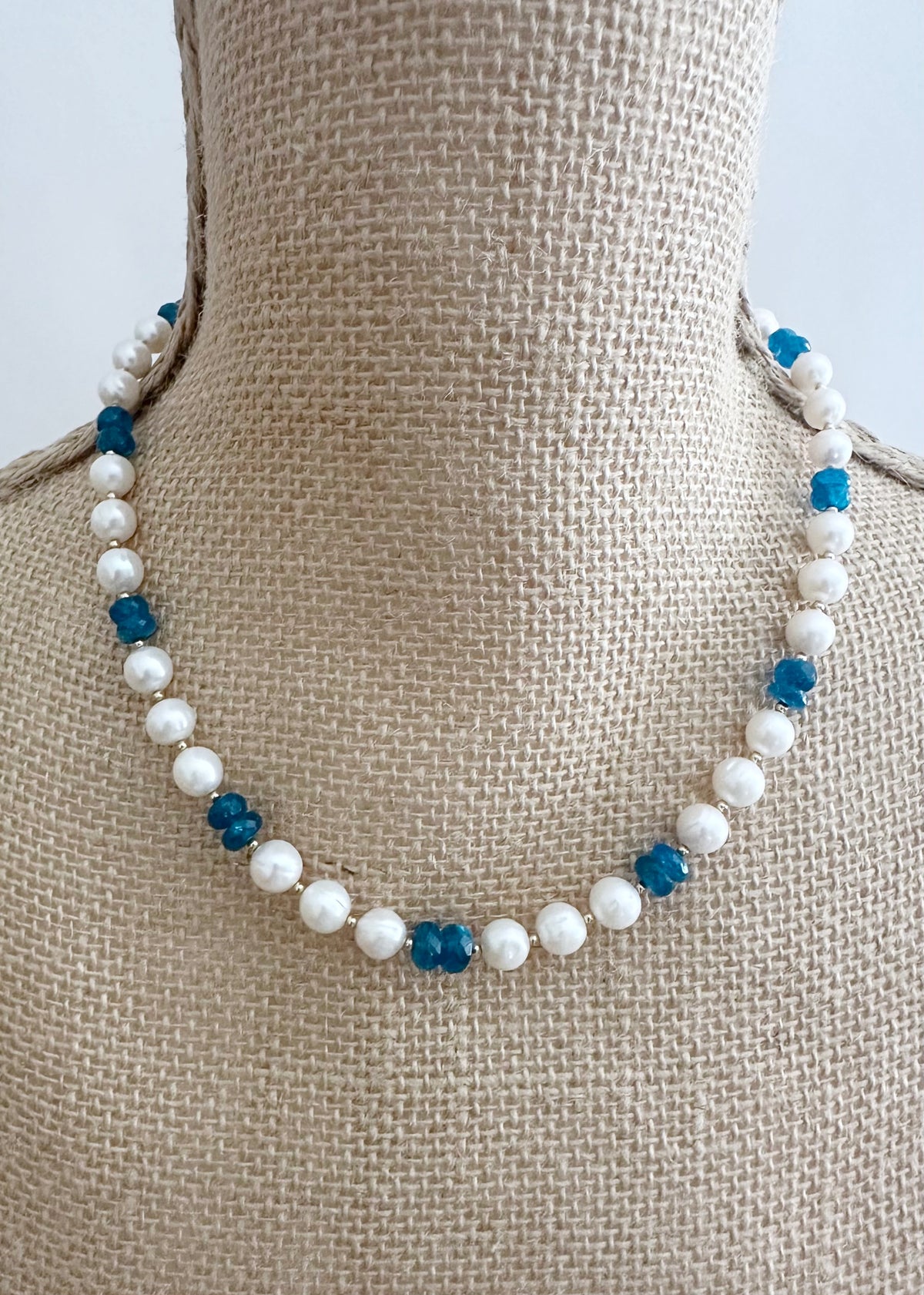 Designed and made in Canada, this one-of-a-kind 18.5” Necklace with 2.5" extender chain features a gorgeous shade of Faceted Blue Apatite(AAA grade) with lustrous white Pearls accented by tiny Gold beads and a Gold-filled Clasp. This Apatite is beautiful!