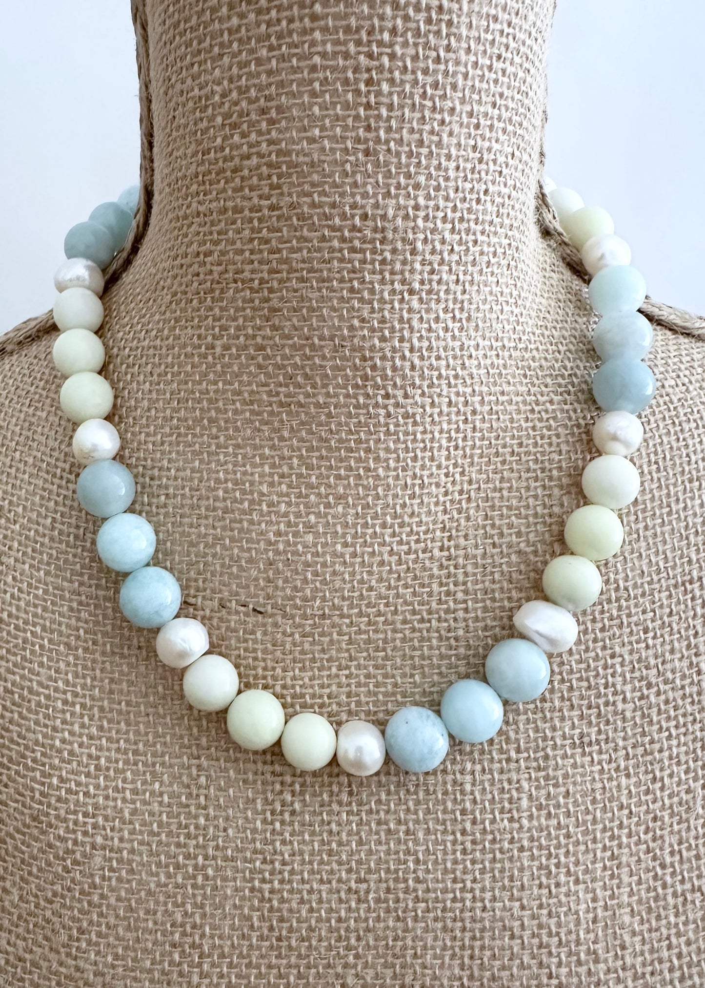 Designed and Made in Canada, this Limited-Edition 20” Necklace combines soothing Blue Aquamarine, Pale Green Jasper, and Luminous Freshwater Pearls into an Effortlessly Elegant Piece. This is perfect for Layering or Wearing Alone. Timeless, versatile, and made to wear well every day with a Simple, Secure Magnetic Clasp.