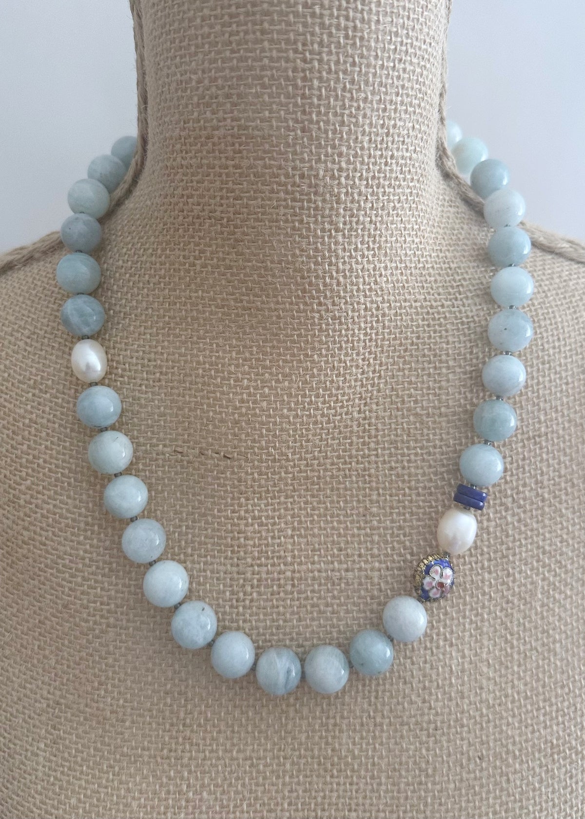 Designed and made in Canada, this Limited Edition Necklace combines Soft Blue Aquamarine, Lapis Rondelles, a Royal Blue Cloisonné Bead and Luminous Freshwater Pearls for an Effortlessly Elegant piece, finished with a Magnetic Clasp. The 22.5