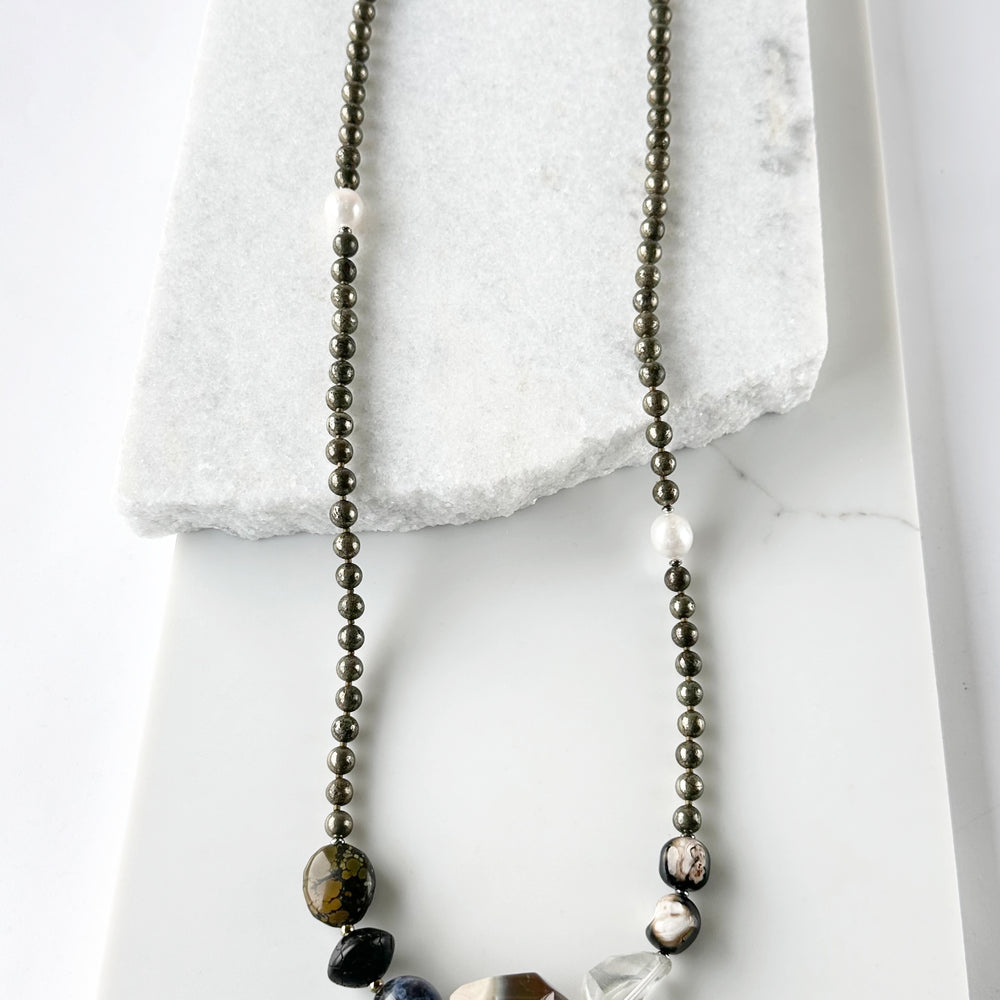 Stunning! This Long (39.5”) Necklace features Large Faceted Agate, Sodalite, Clear Quartz, Pyrite, Brown Turquoise, and Two Edison Pearls, Finished with a Charm Clasp.  This piece can be worn as is or Doubled. 