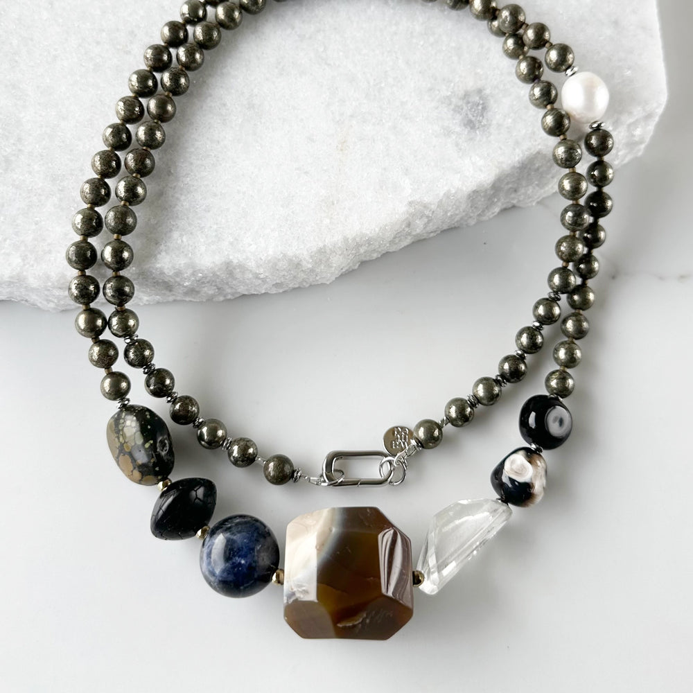 Stunning! This Long (39.5”) Necklace features Large Faceted Agate, Sodalite, Clear Quartz, Pyrite, Brown Turquoise, and Two Edison Pearls, Finished with a Charm Clasp.  This piece can be worn as is or Doubled. 