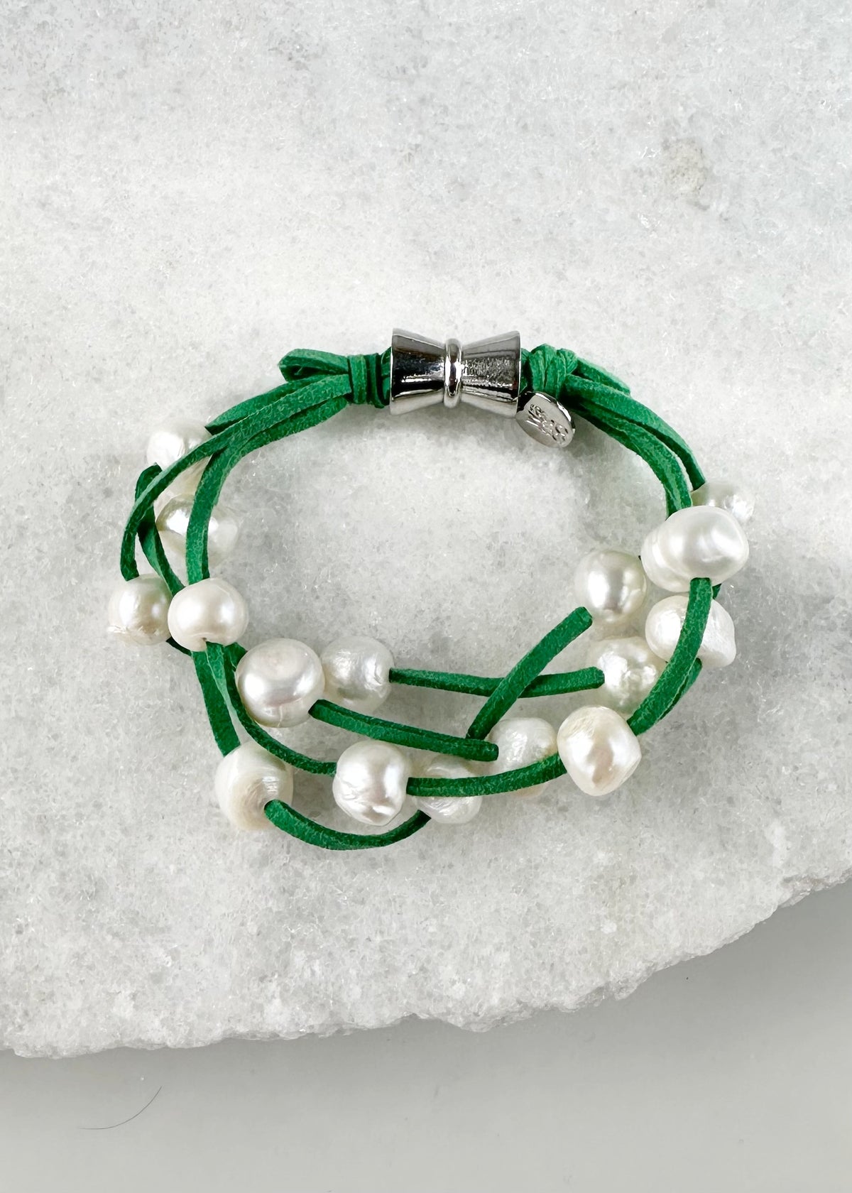 Designed in Canada, the 8” Anna Bracelet has 4 strands of Large, Organic Pearls Floating on Pink or Green Vegan Suede. Easy to take on/off with a Secure Magnetic Clasp.