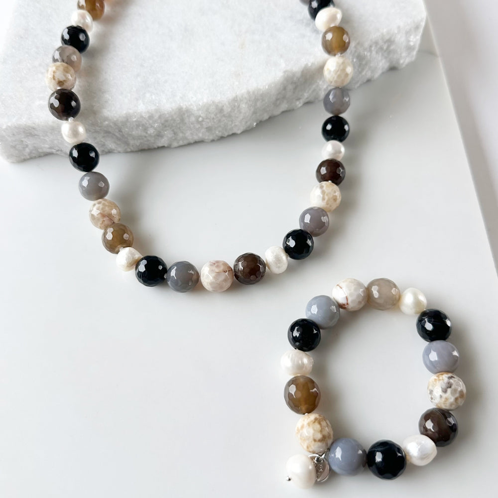 
                      
                        White Freshwater Pearl with Beige Semi-Precious Stone Mix Stretch Bracelet.  Perfect for layering! Shown with Matching Necklace
                      
                    