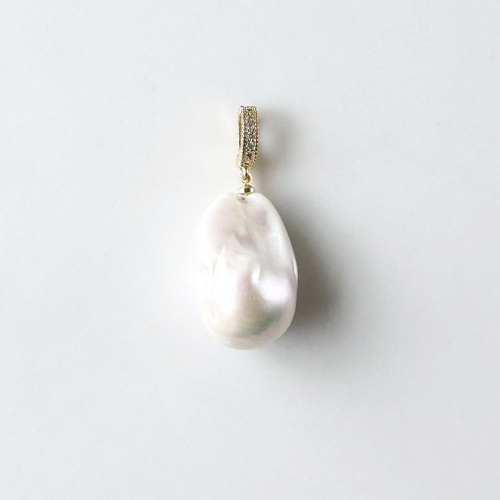 Large Baroque White Freshwater Pearl Pendant on Gold-Plated Bail with In-Laid Cubic Zirconia.  This Clip-On Pendant allows you to wear it with many of your favorite Pearl Necklaces.