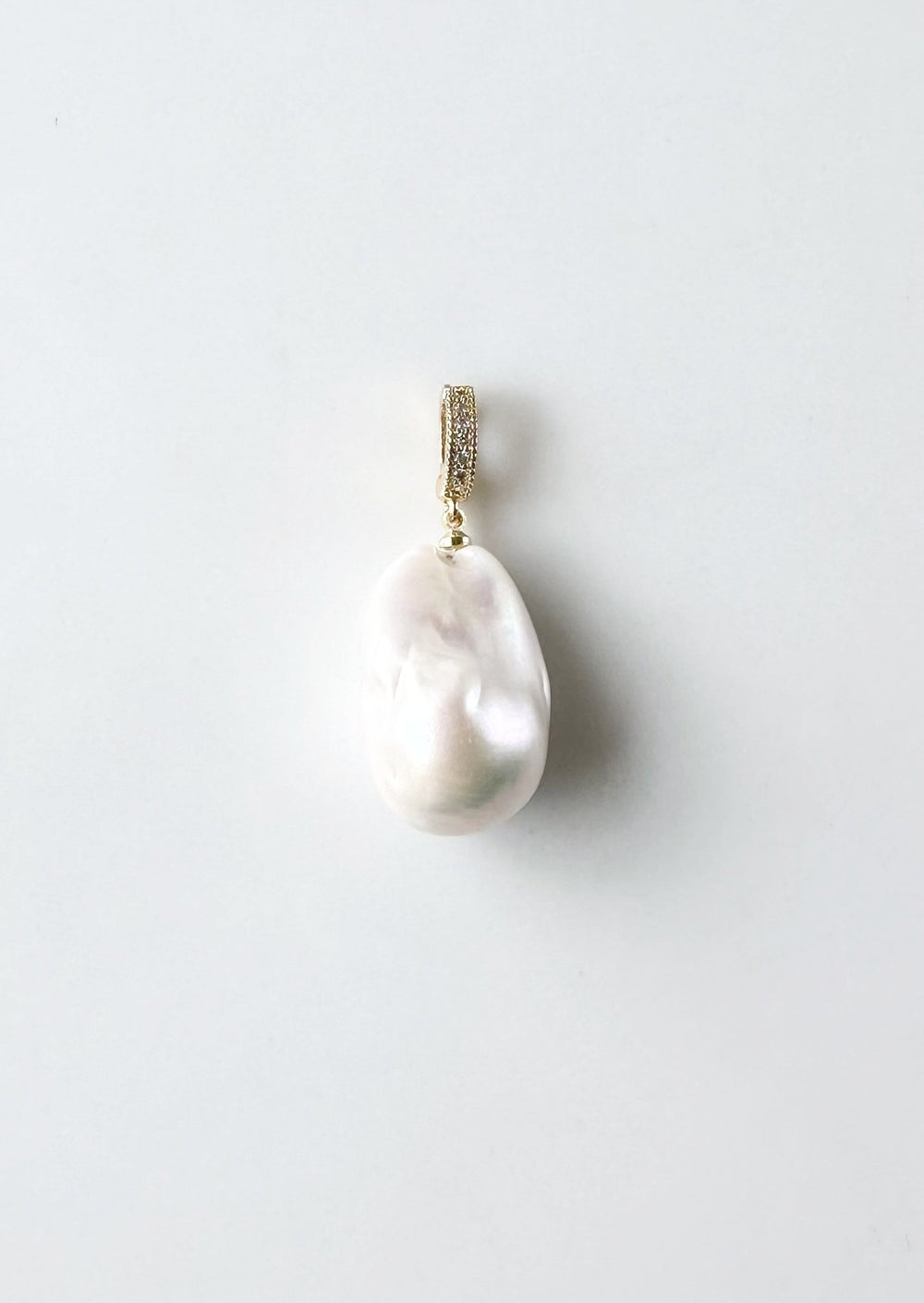 Large Baroque White Freshwater Pearl Pendant on Gold-Plated Bail with In-Laid Cubic Zirconia.  This Clip-On Pendant allows you to wear it with many of your favorite Pearl Necklaces.