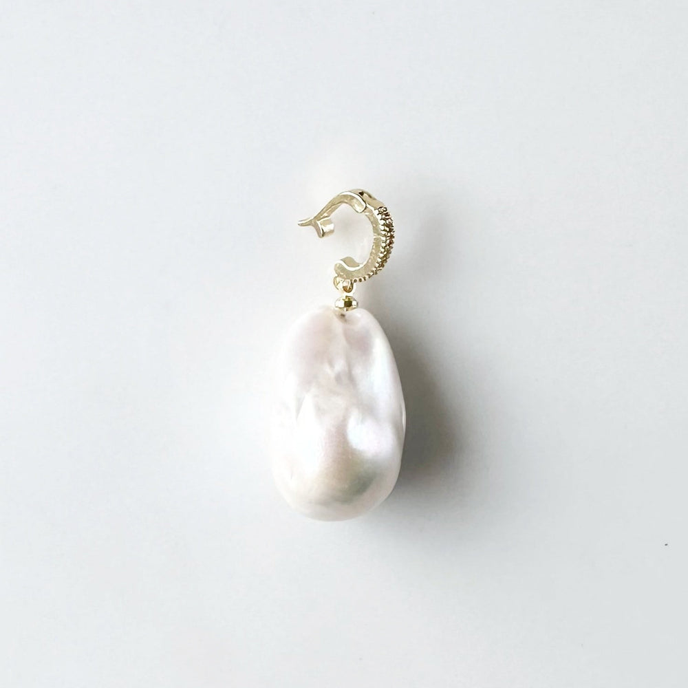 
                      
                        Large Baroque White Freshwater Pearl Pendant on Gold-Plated Bail(shown open) with In-Laid Cubic Zirconia.  This Clip-On Pendant allows you to wear it with many of your favorite Pearl Necklaces.
                      
                    
