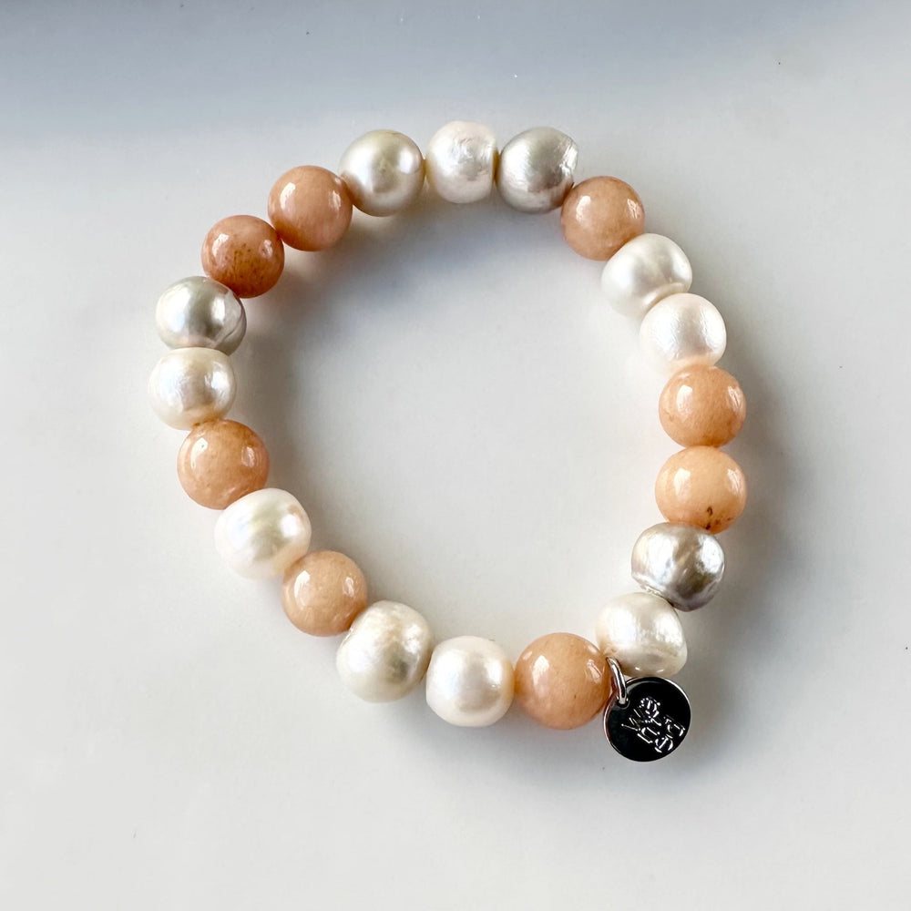 
                      
                        Freshwater Pearl and Faceted Agate Necklace in Peach, highlighting White Pearls.
                      
                    