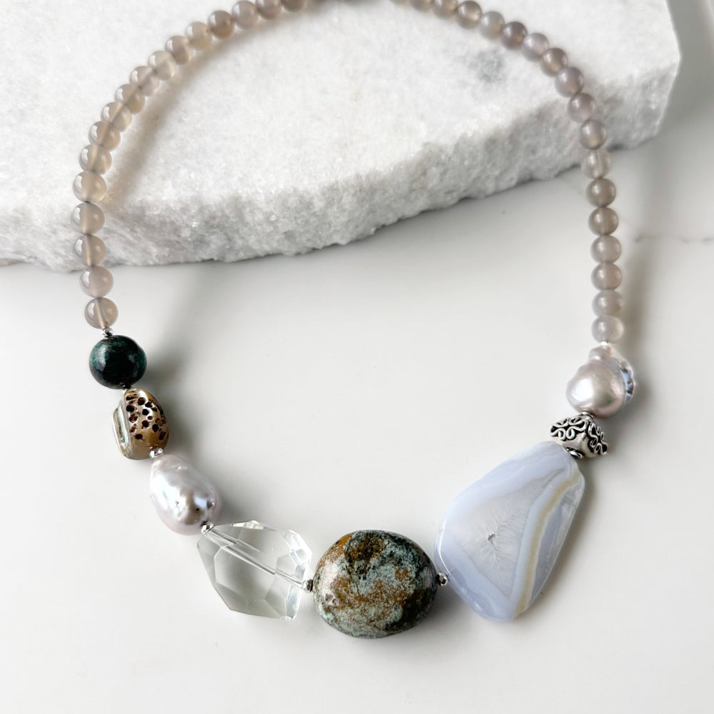 This Unique 20” Necklace Features Blue Lace & Grey Agate, Turquoise, Azurite Chrysocolla, Shell, Crystal, Beautiful Baroque Pearls and Finished with Silver Beads and a Strong Secure Magnetic Clasp for Easy Wear.