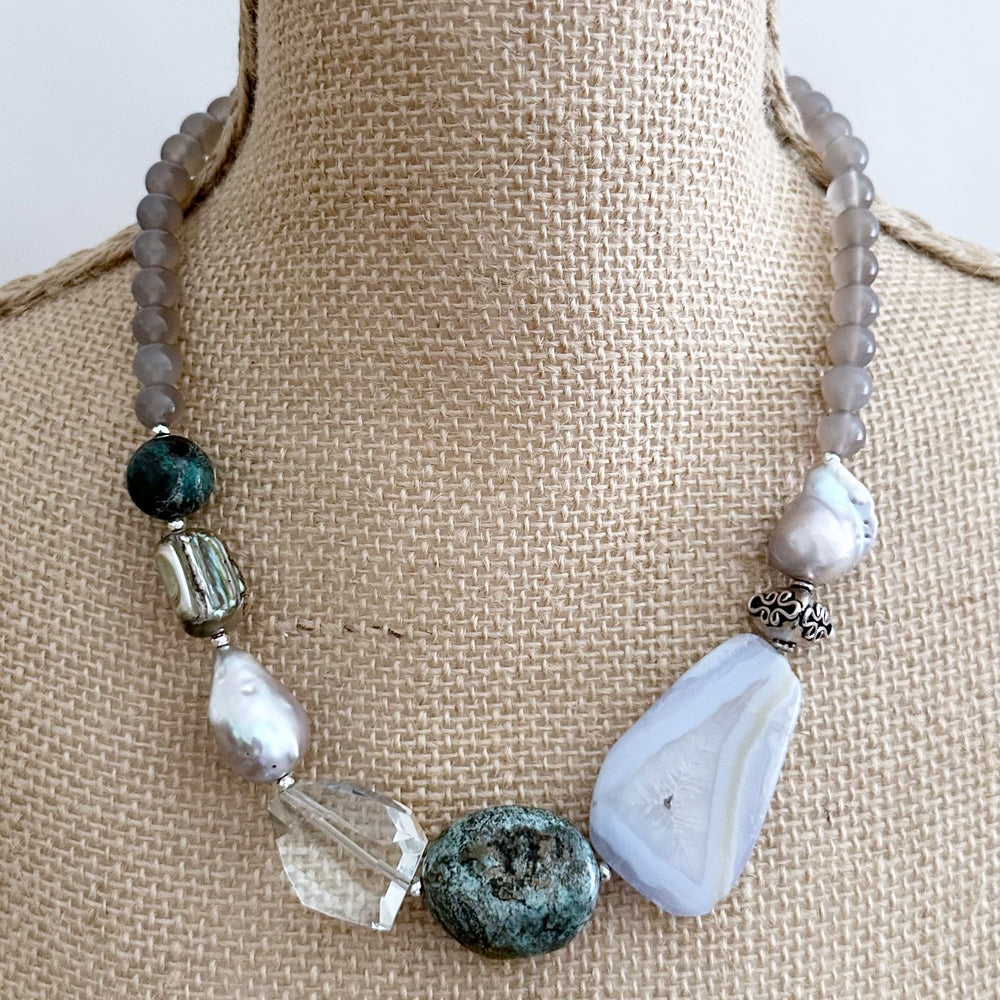This Unique 20” Necklace Features Blue Lace & Grey Agate, Turquoise, Azurite Chrysocolla, Shell, Crystal, Beautiful Baroque Pearls and Finished with Silver Beads and a Strong Secure Magnetic Clasp for Easy Wear.