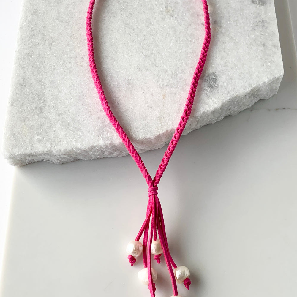 
                      
                        White Freshwater Pearl Necklace on Braided Fuchsia Vegan Suede.  Strong Secure Magnetic Clasp for Easy Wear.
                      
                    