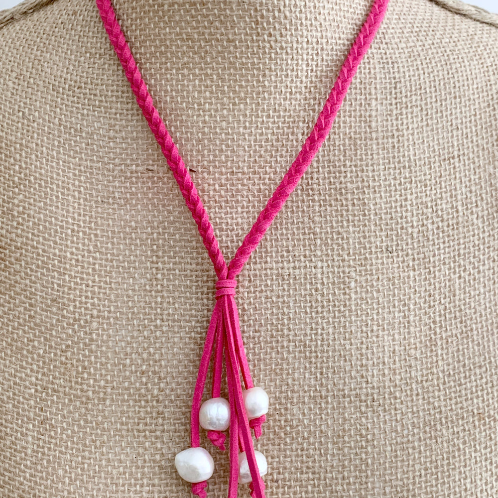 
                      
                        White Freshwater Pearl Necklace on Braided Fuchsia Vegan Suede.  Strong Secure Magnetic Clasp for Easy Wear. Shown on Bust
                      
                    