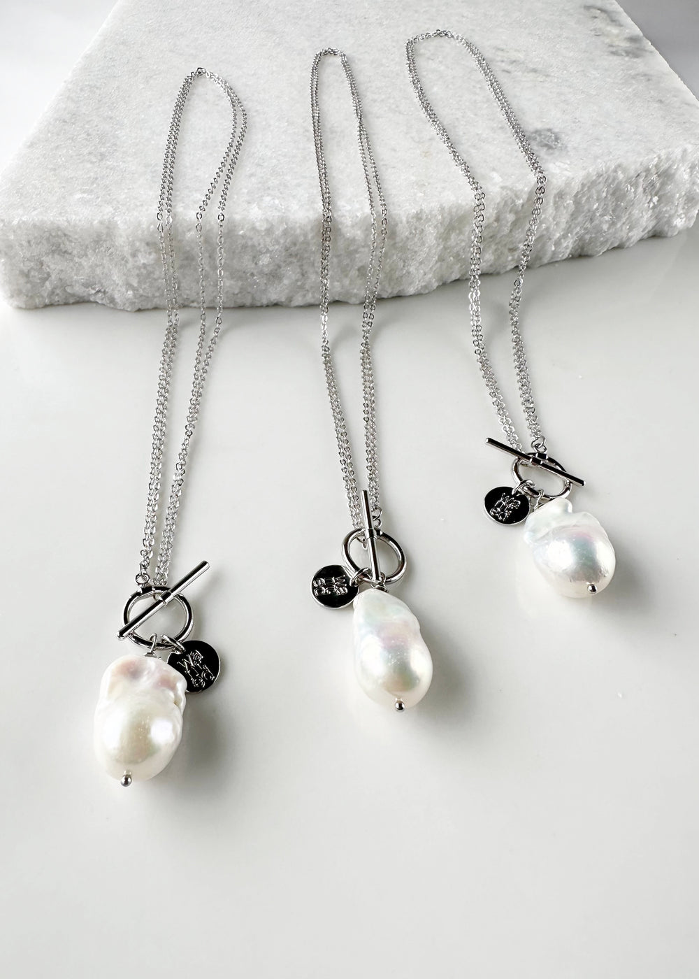 Extra Large White Baroque Freshwater Pearl on White Gold-Plated Chain.  Three shown to indicate Unique Shapes.