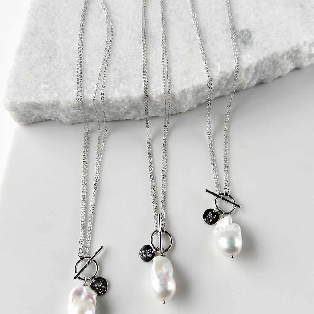 
                      
                        Extra Large White Baroque Freshwater Pearl on White Gold-Plated Chain. Three Shown to indicate Unique Shapes.
                      
                    