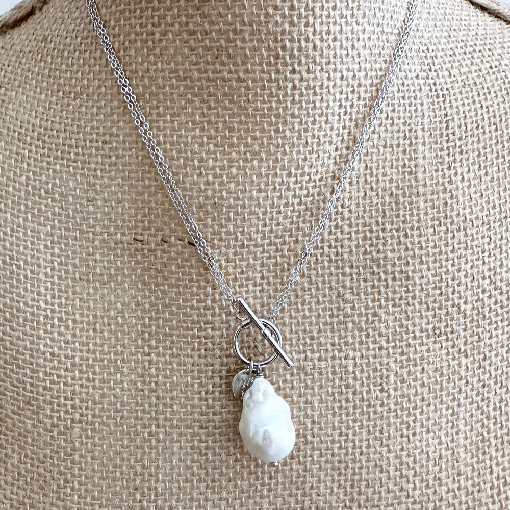 
                      
                        Extra Large White Baroque Freshwater Pearl on White Gold-Plated Chain. On Bust
                      
                    